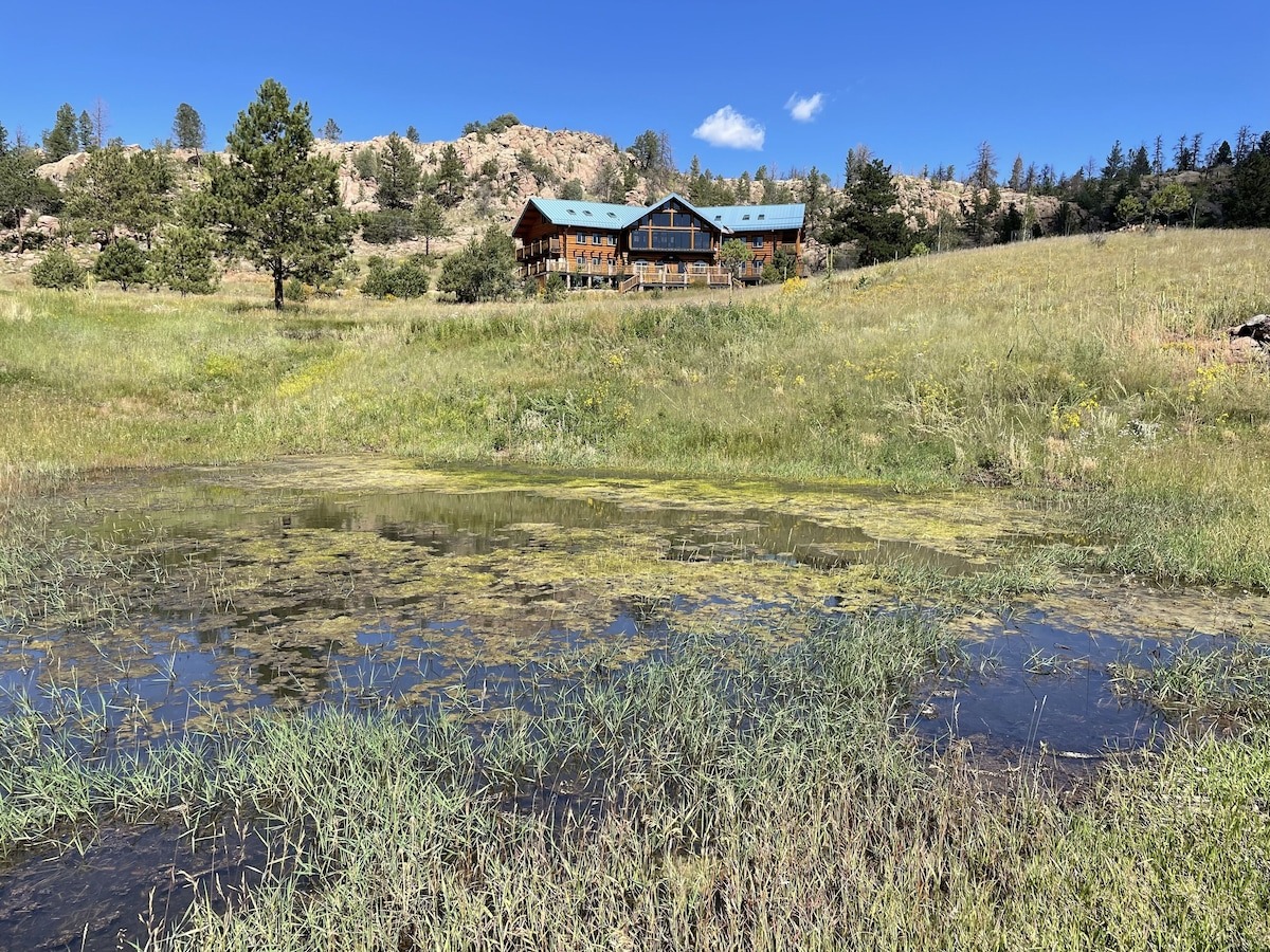 log cabin sets on hill on the mountains - colorado micro wedding + elopement venue 