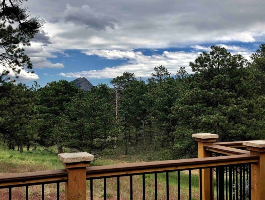 deck overlooks mountain range at colorado airbnb micro wedding and elopement venue