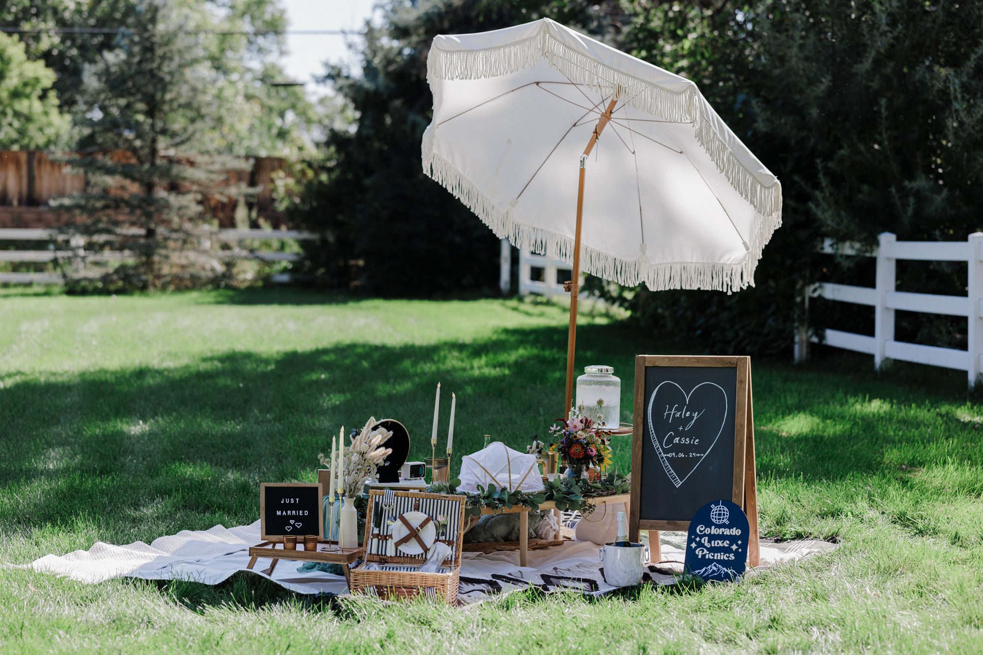 luxury picnic sits on the ground during colorado elopement