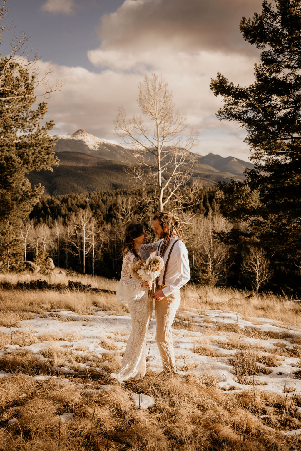 bride and groom pose for colorado micro wedding photographer during winter elopement.