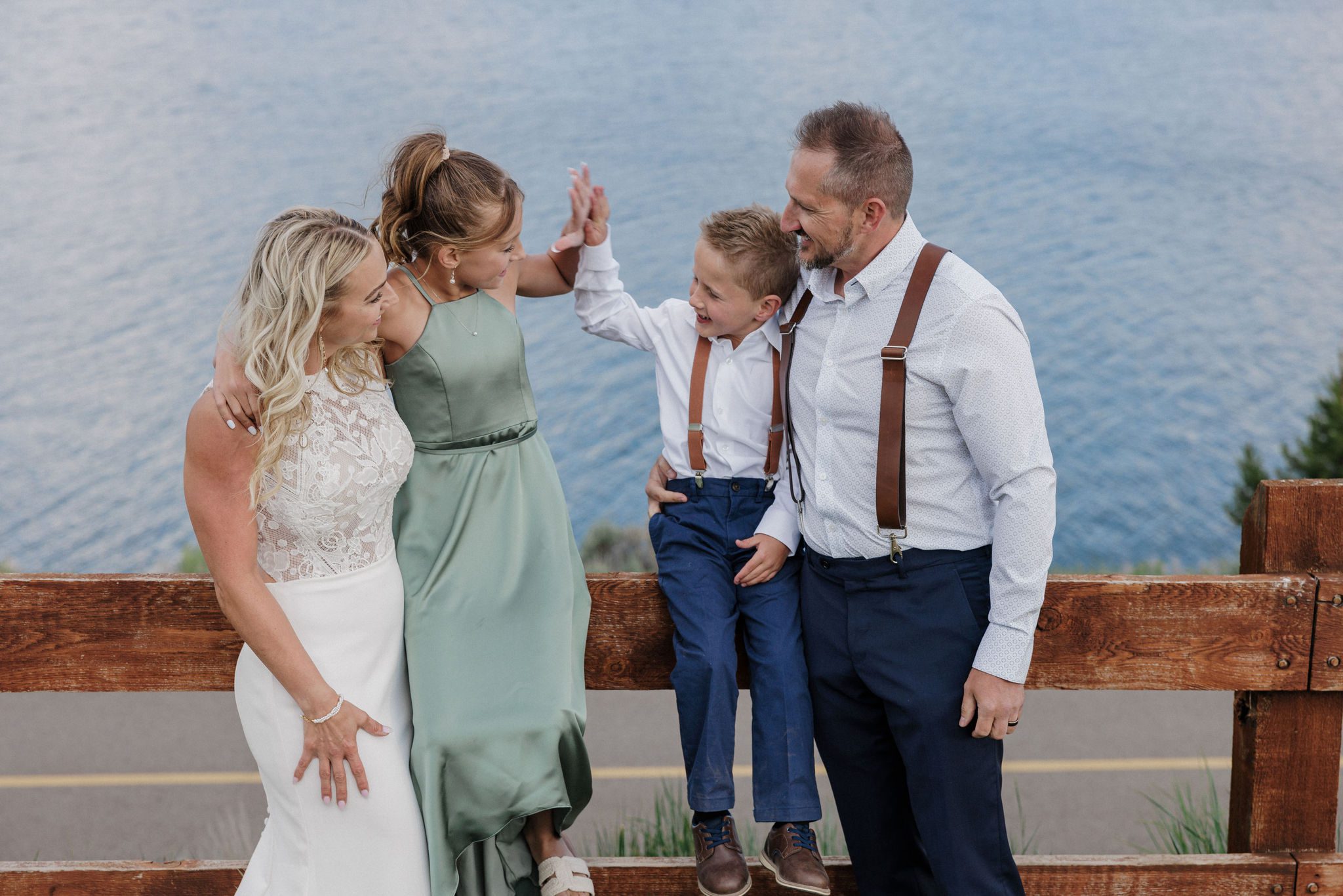 bride, groom, and children pose for wedding photos during colorado elopement with kids