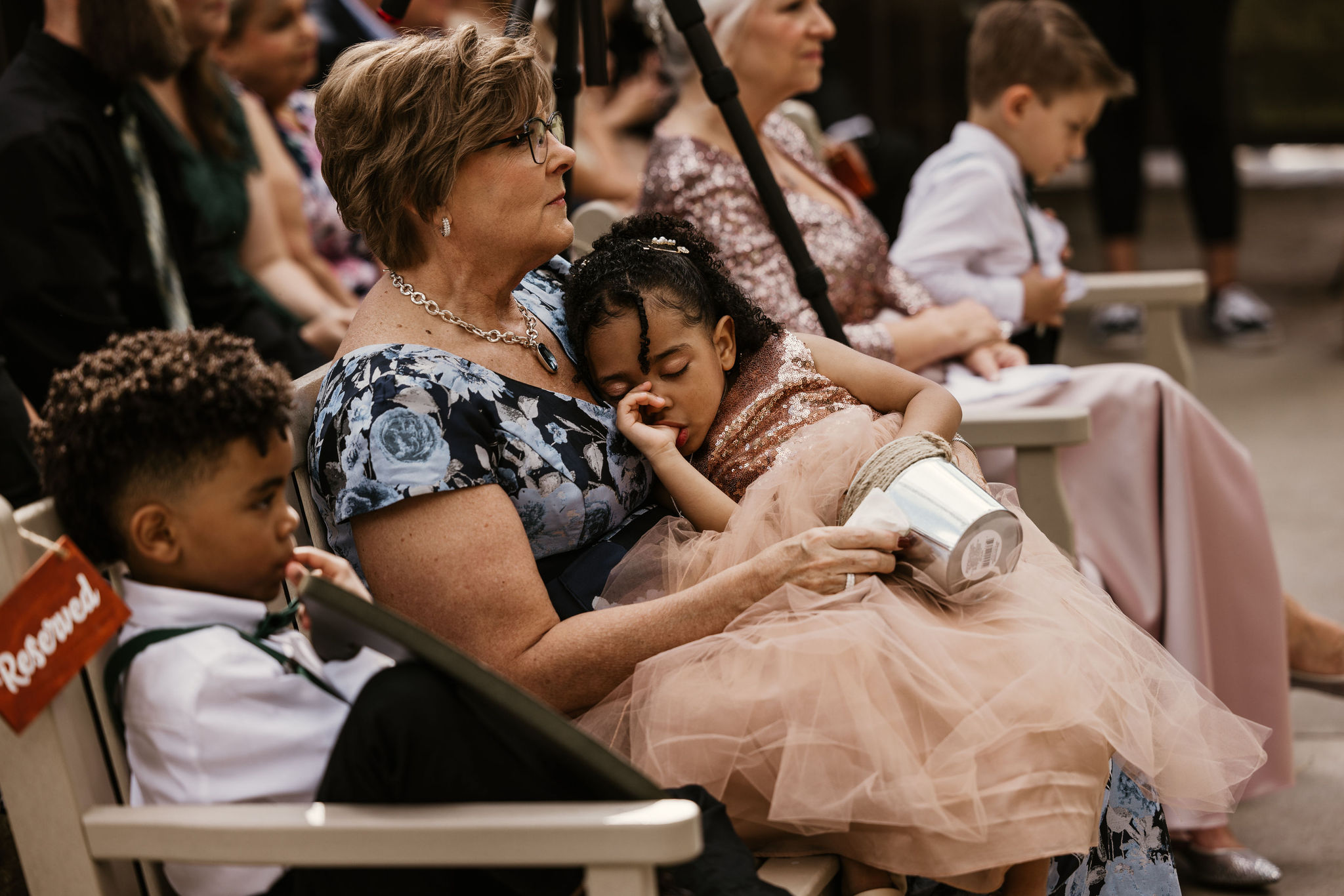 grandmother watches kids during a wedding in colorado.