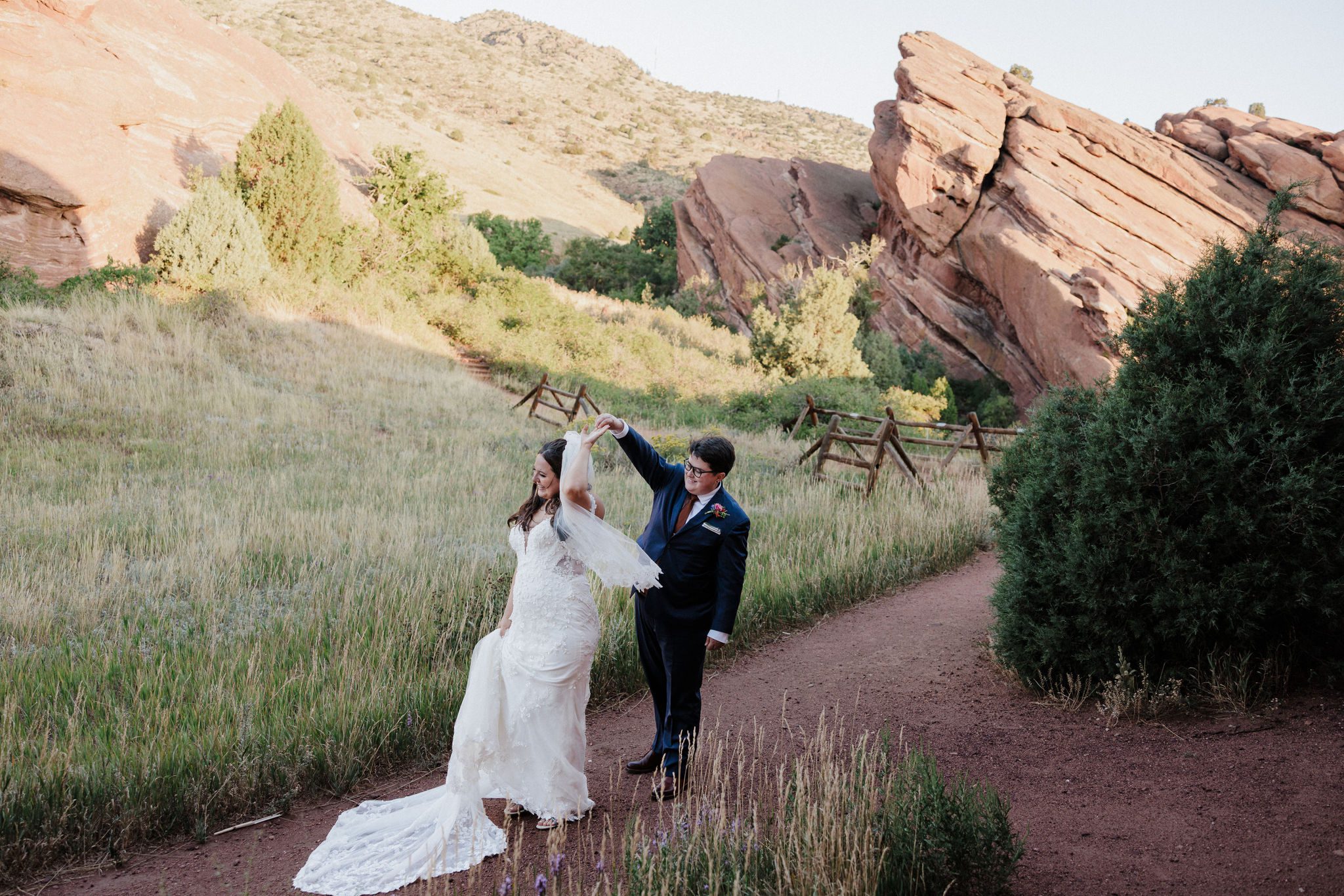 as one of their first look ideas for their wedding, one bride twirls the other bride