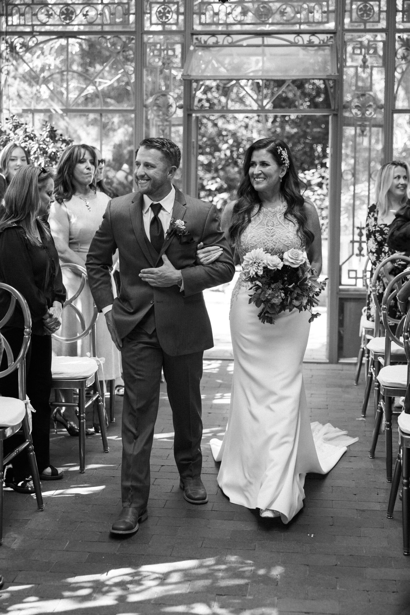 instead of doing a first look idea for their wedding, bride walks down the aisle with her son