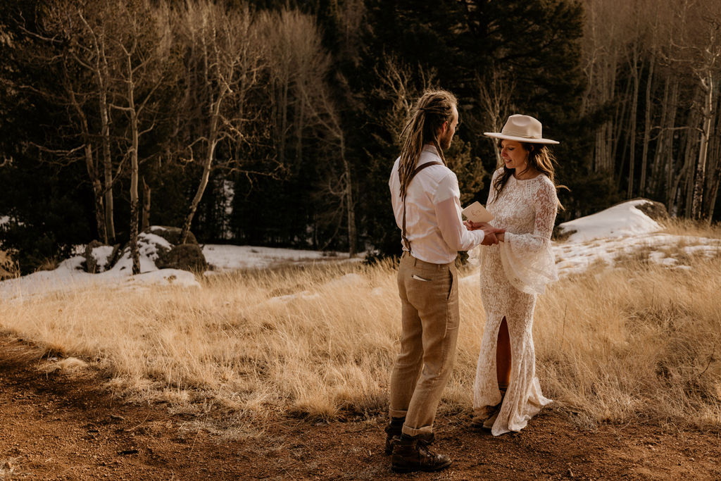 bride and groom say wellding vows while self solemnizing in colorado