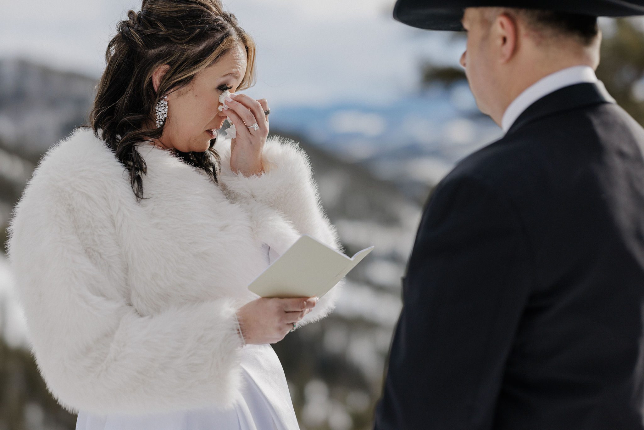 bride wipes away tear as they choose to self solemnize as their second wedding idea