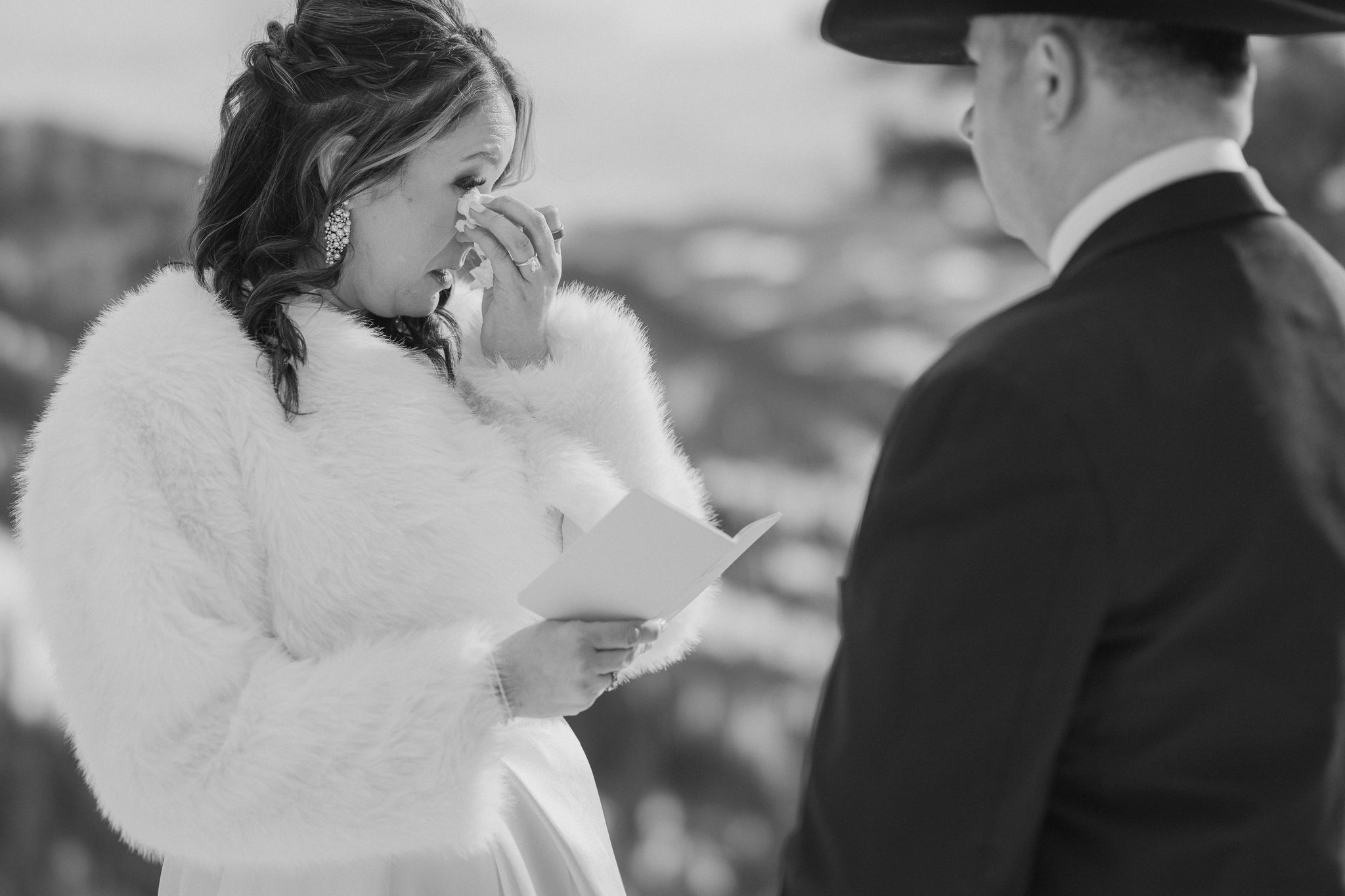 Bride cries during private vow exchange at Sapphire Point elopement.