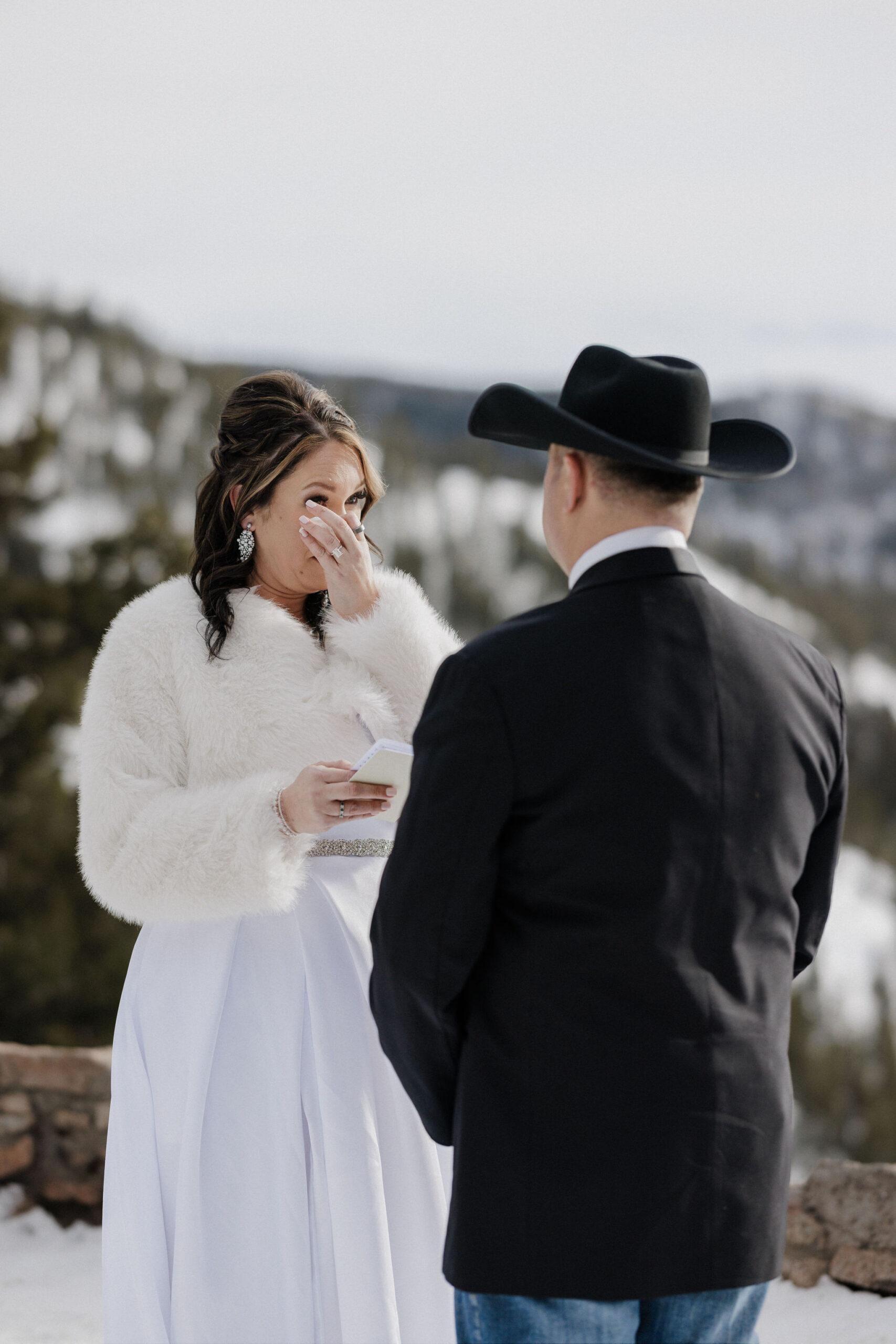 Bride and groom say wedding vows during self-solemnizing colorado elopement