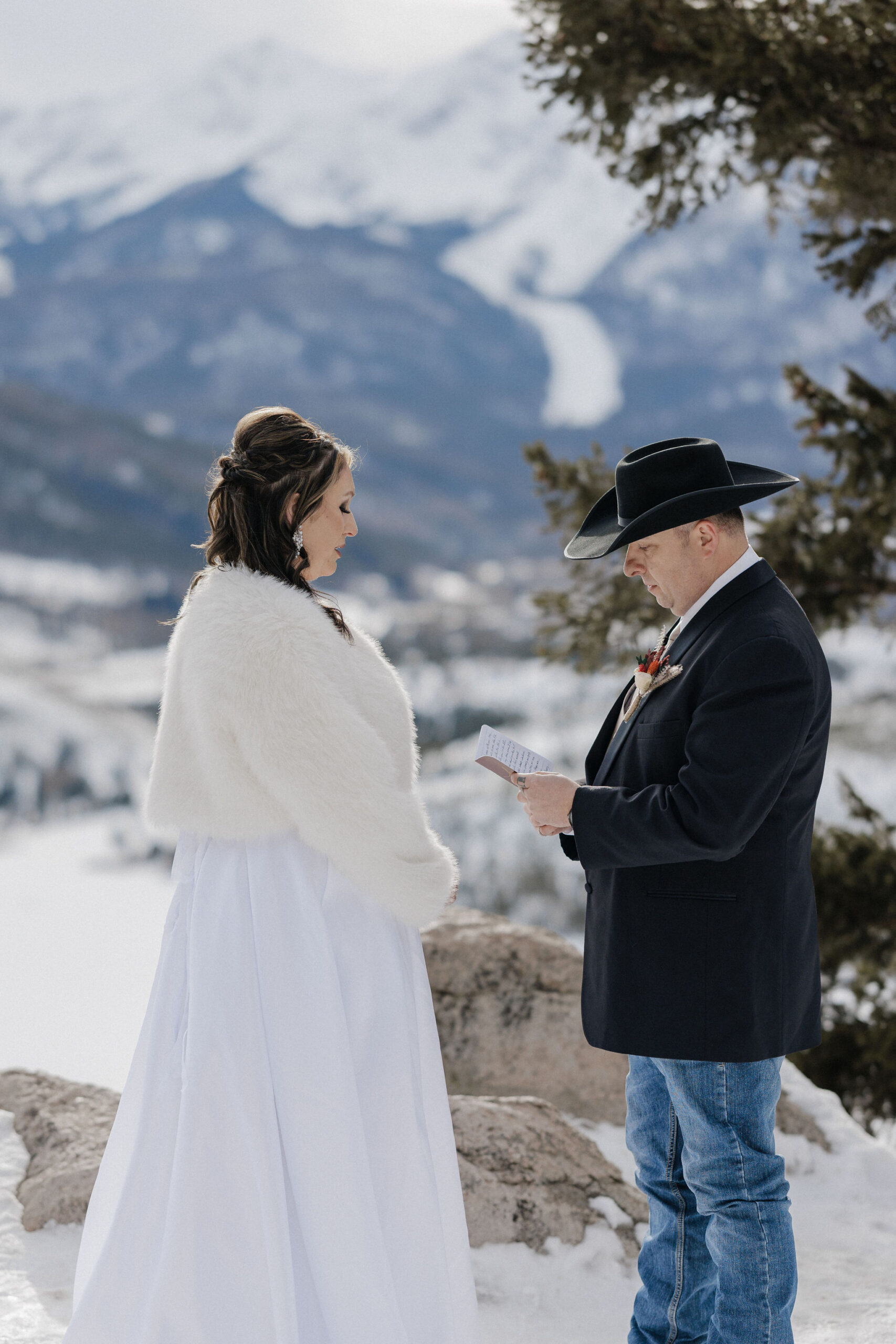 bride and groom read hand written wedding vows during colorado elopement