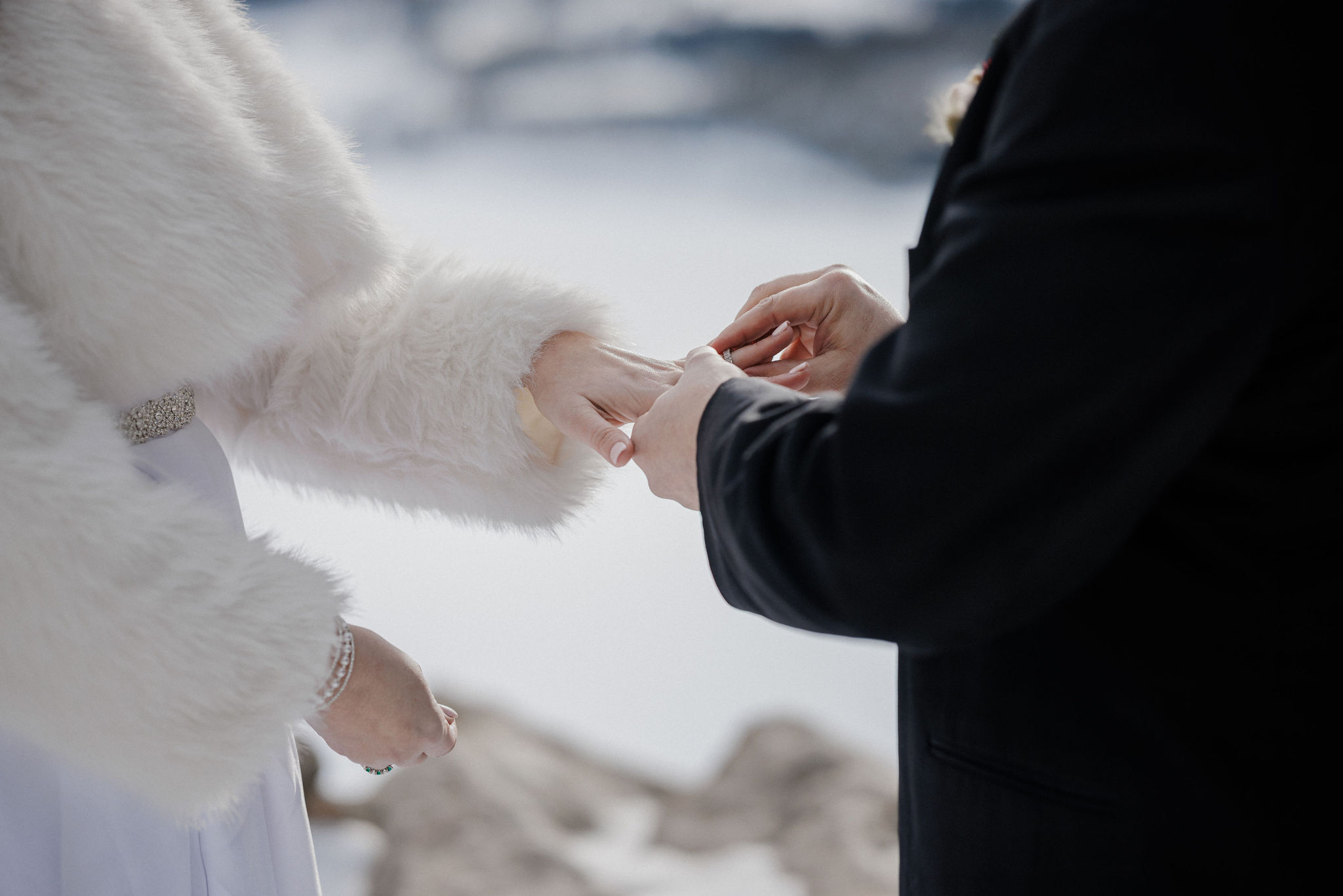 Bride and groom exchange rings during Colorado elopement.