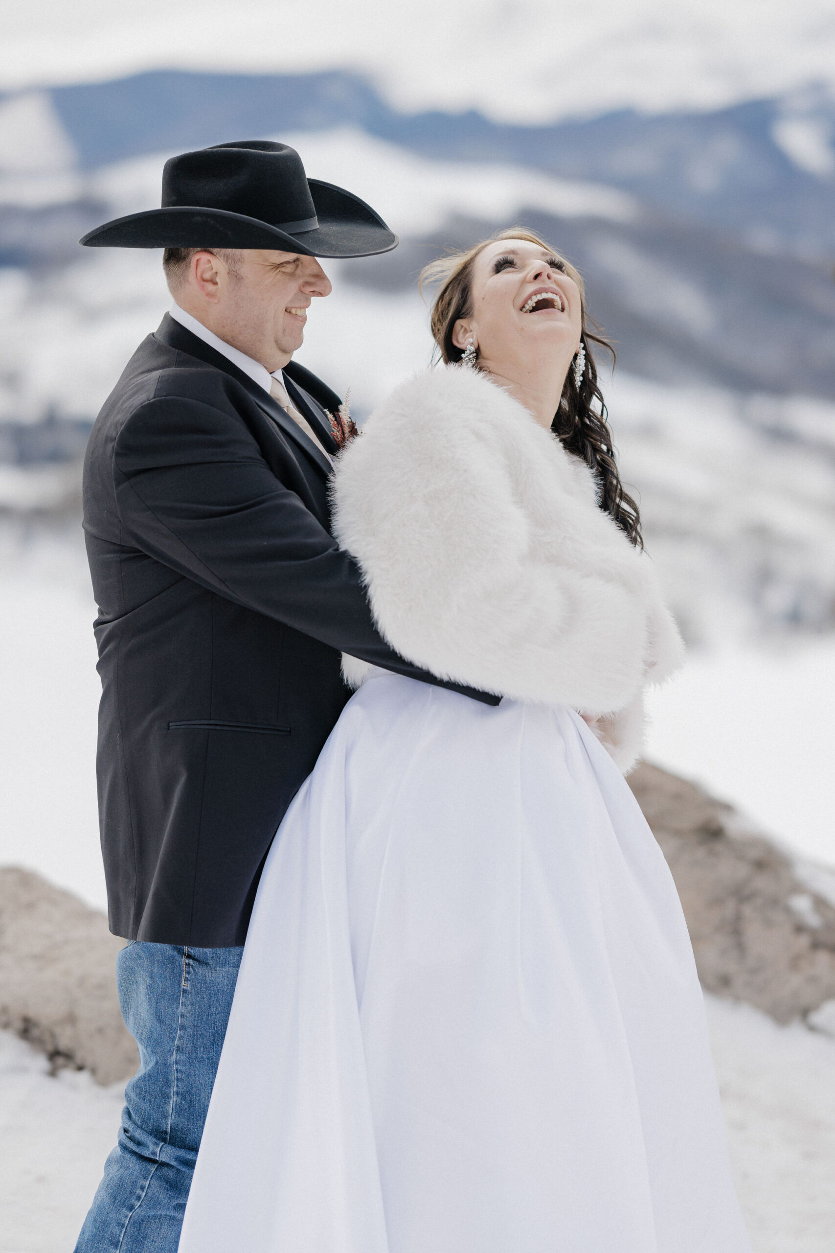 Bride laughs during Sapphire Point elopement portraits.