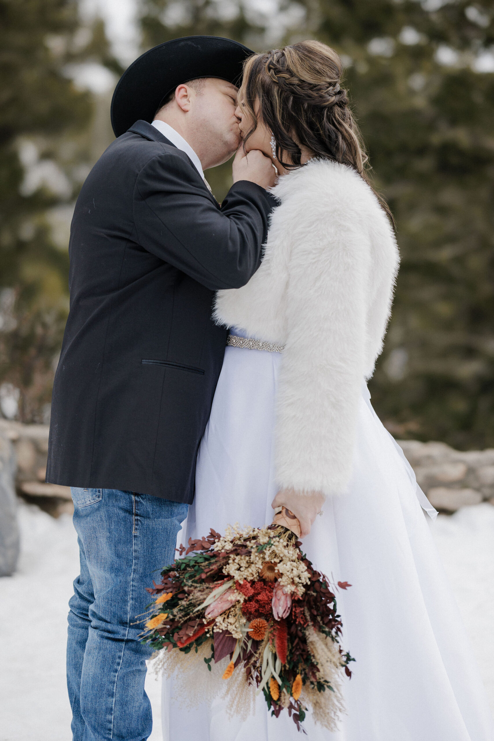 bride and groom kiss after self officiating colorado elopement