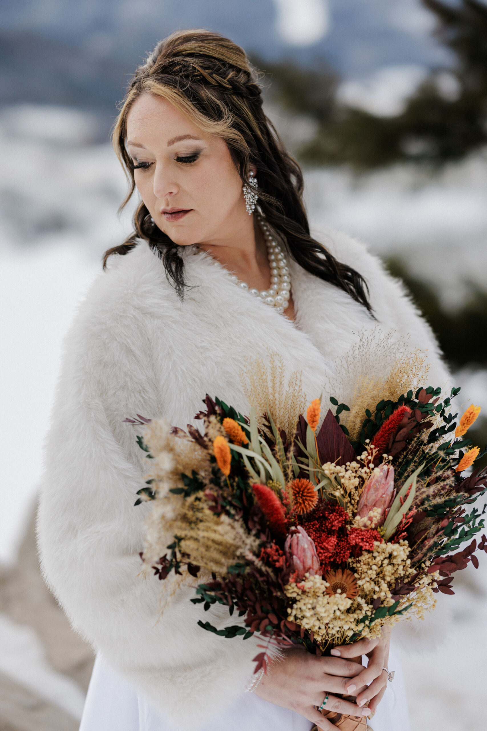 bride poses for wedding photos at sapphire point overlook