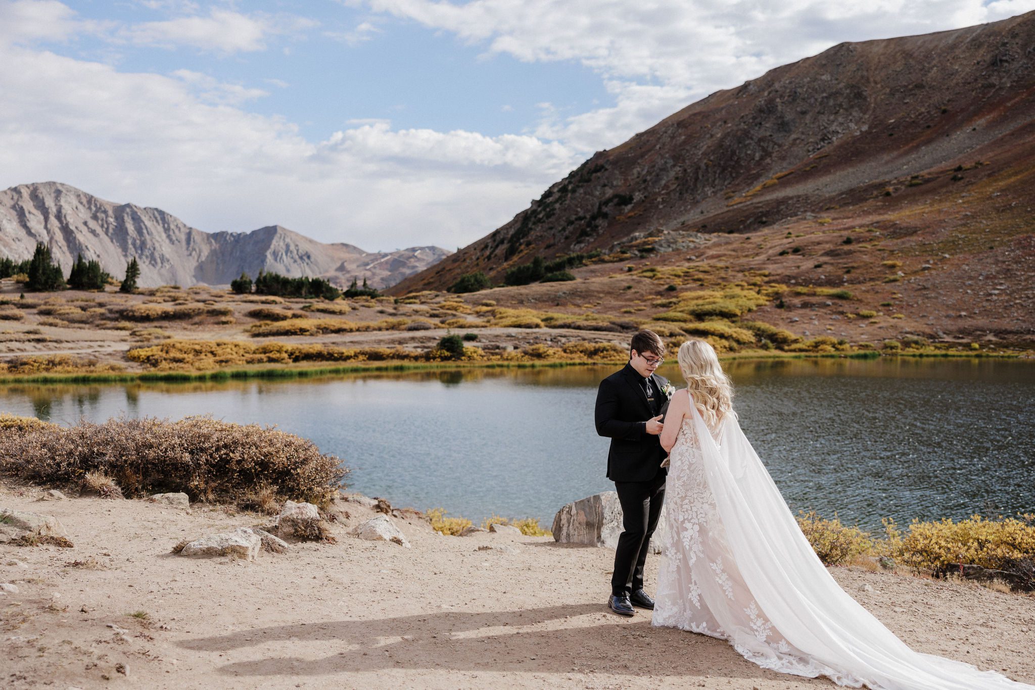 bride and groom say wedding vows during elopement while choosing self-solemnization in colorado