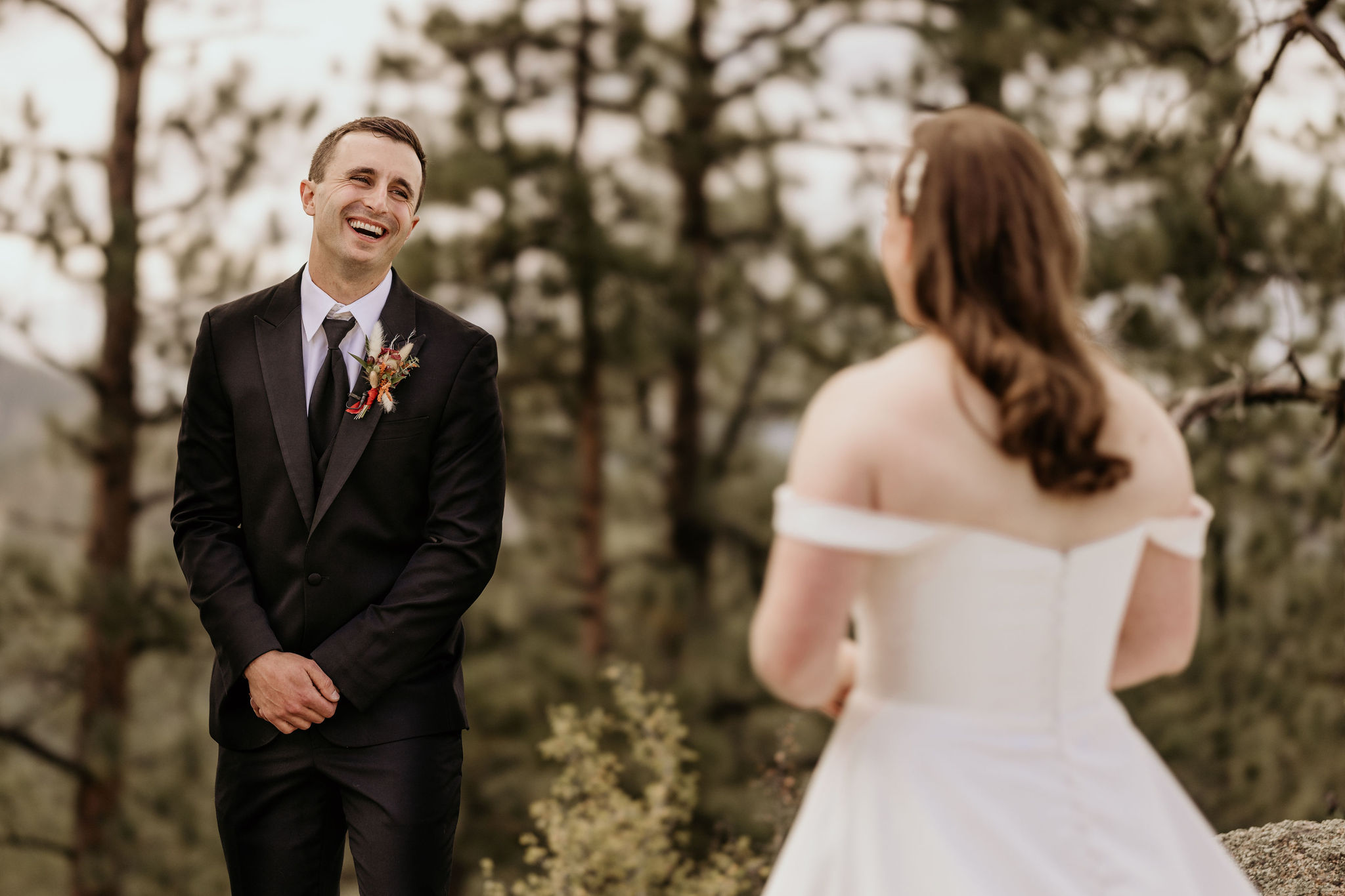 groom shows huge smile during micro wedding first look in colorado