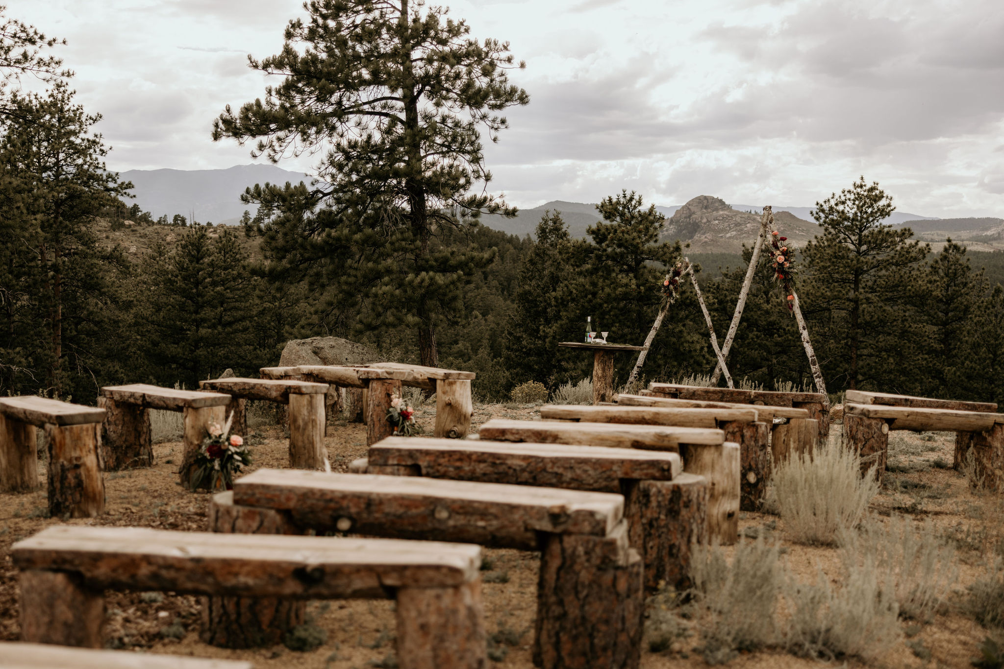 wedding arch and benches set up for a Colorado micro wedding ceremony.