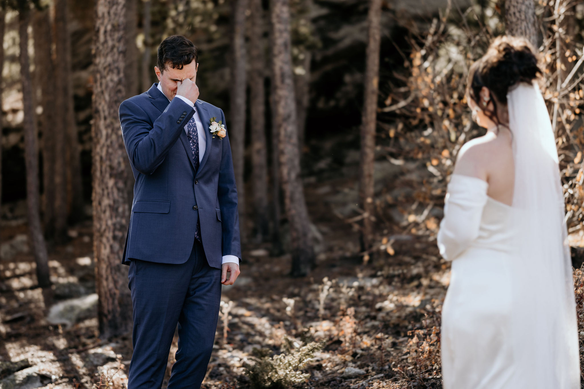 groom turns around and wipes eyes when he sees his bride during elopement first look