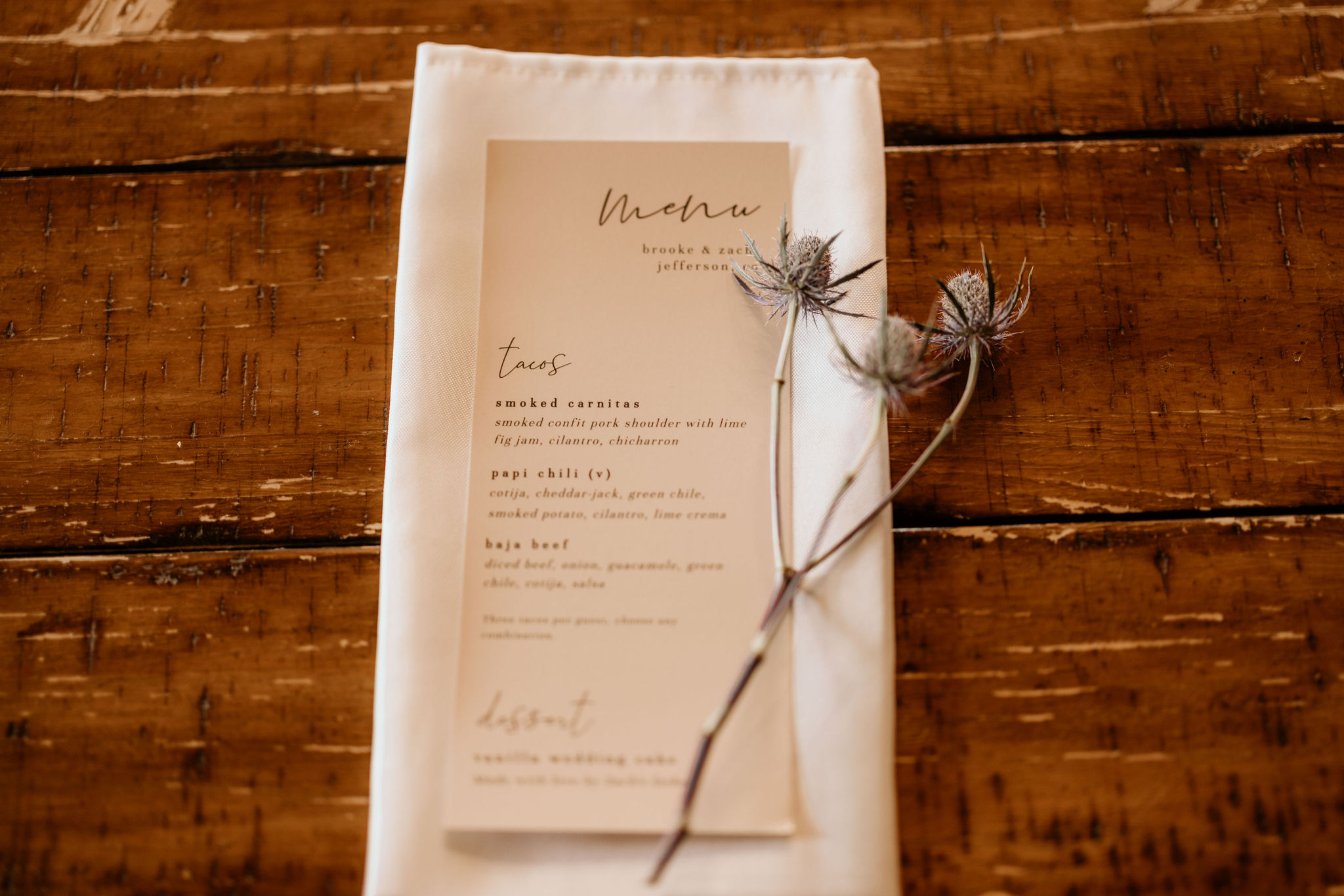 wedding catering menu sits on table in colorado during dry wedding reception