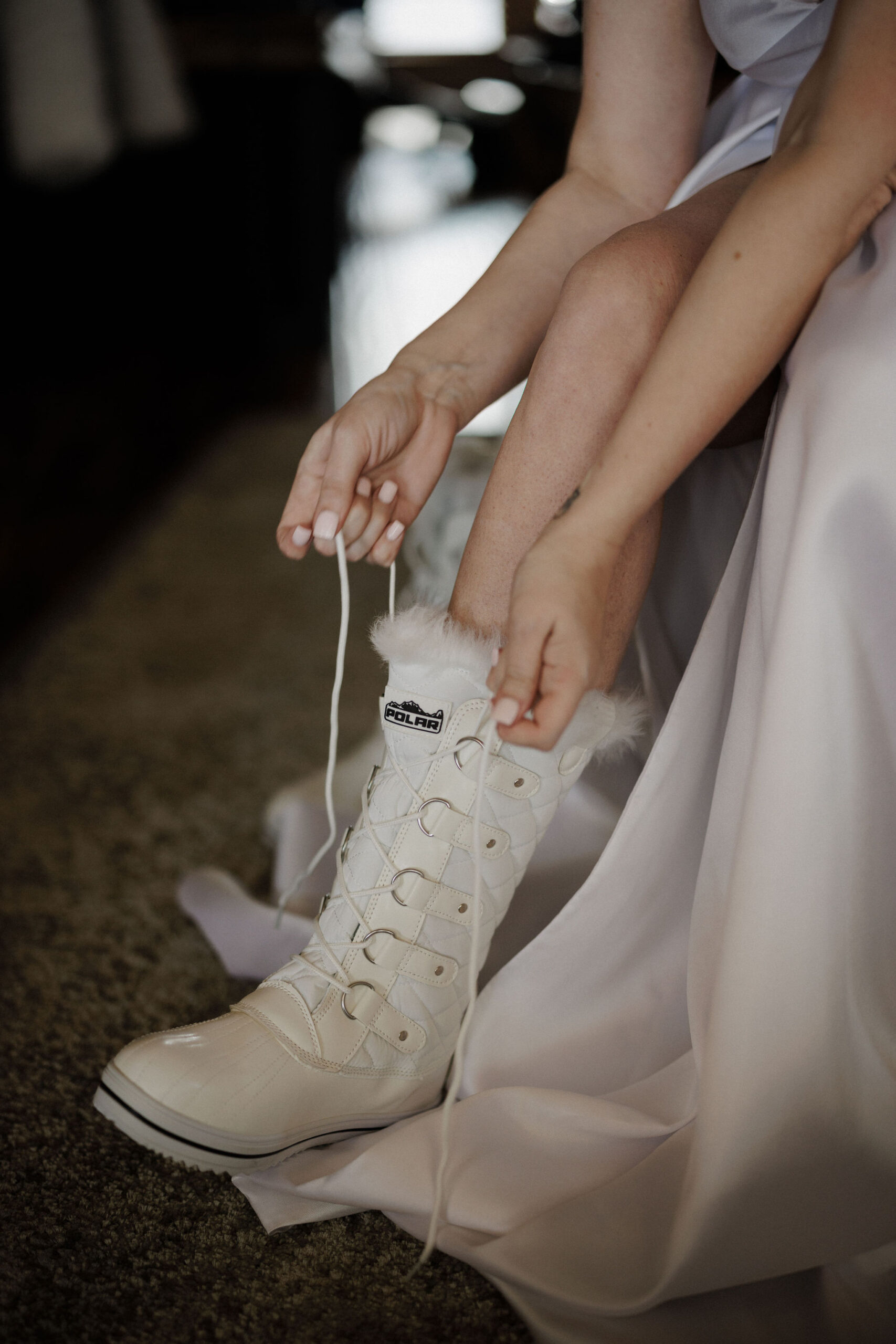 What to Pack For Your Elopement or Micro Wedding, bride puts on boots