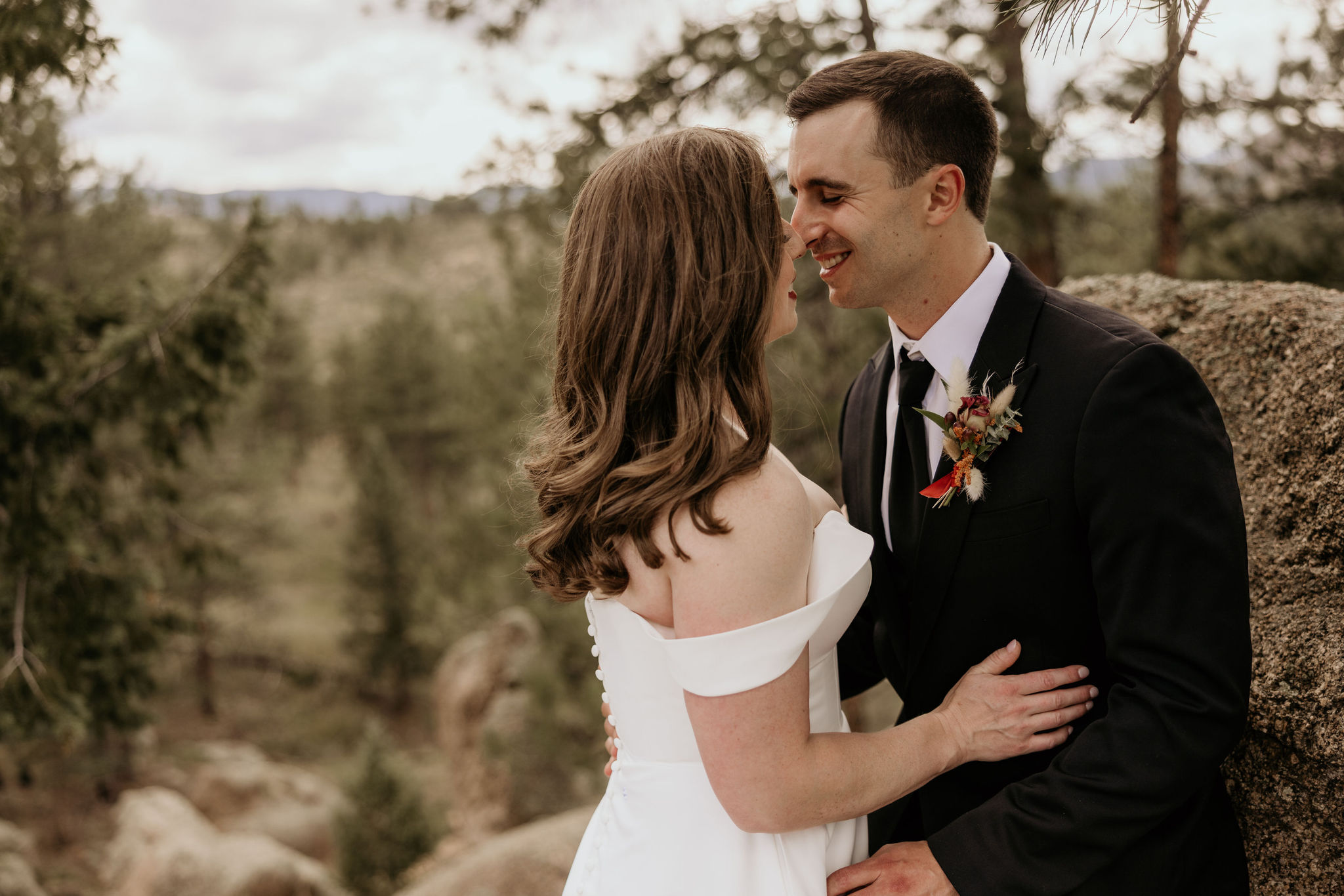 bride and groom kiss during colorado mountain micro wedding