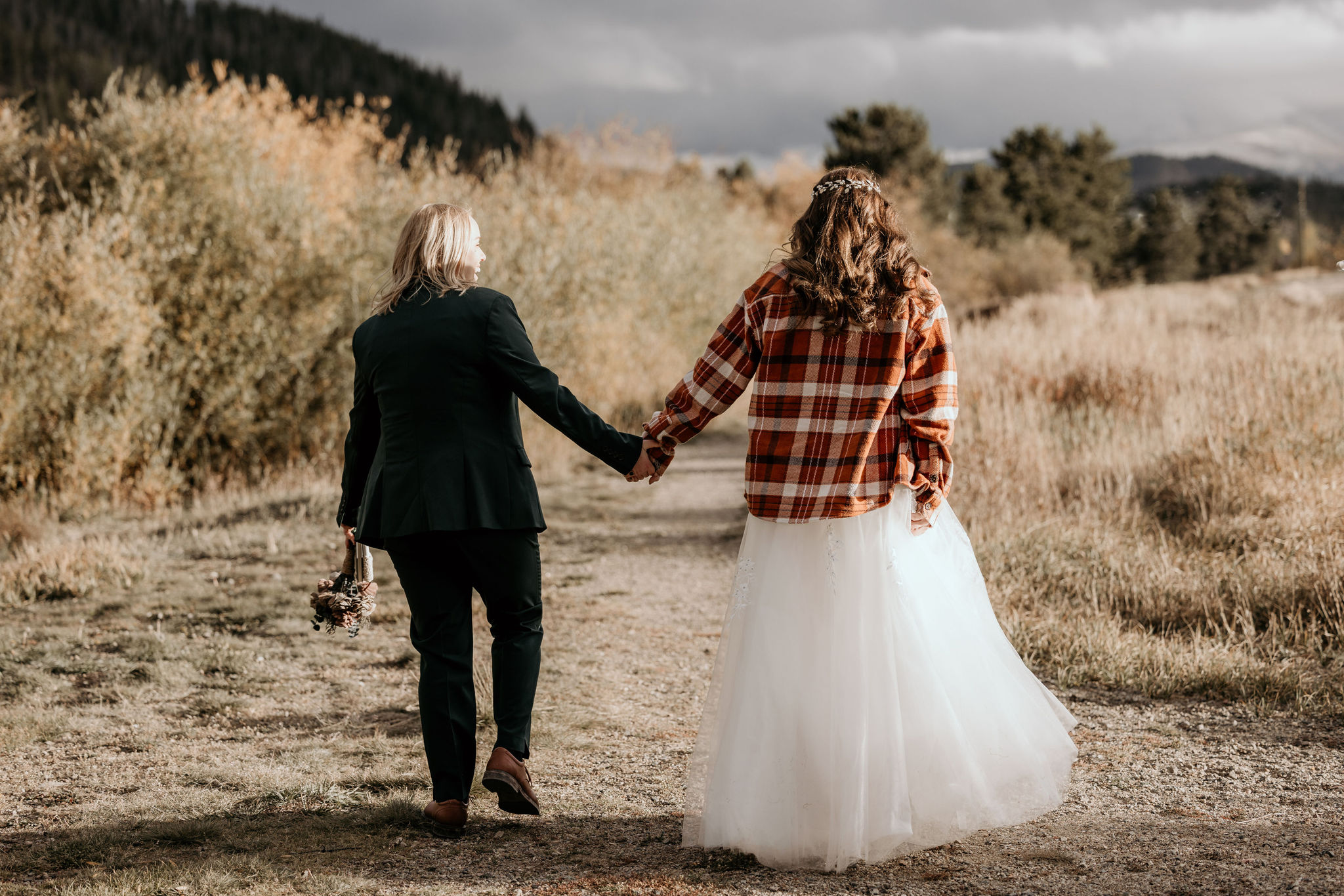 What to Pack For Your Elopement or Micro Wedding, lgbtq+ couple brings jackets to their intimate colorado celebration