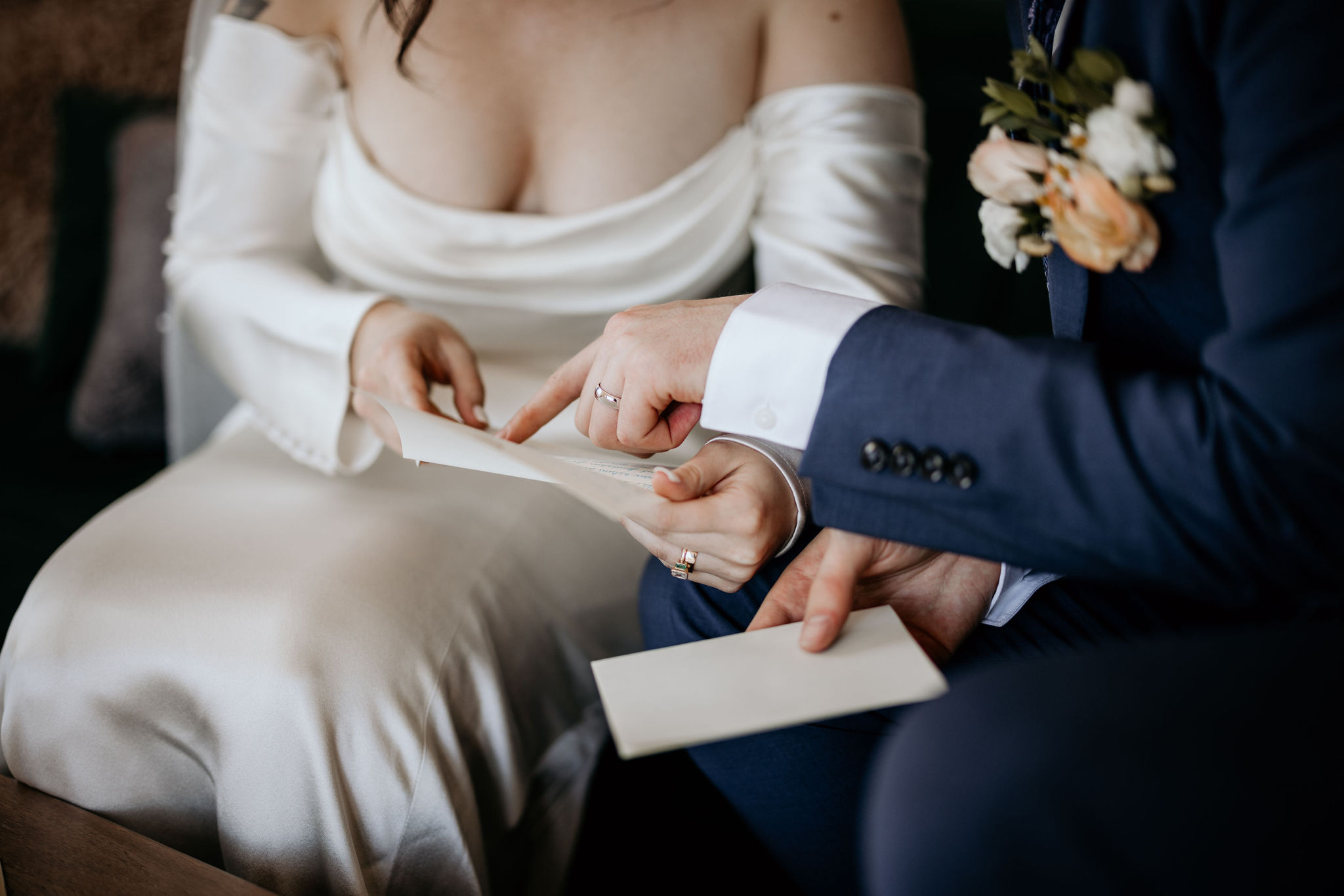 bride and groom read letters from family during colorado elopement