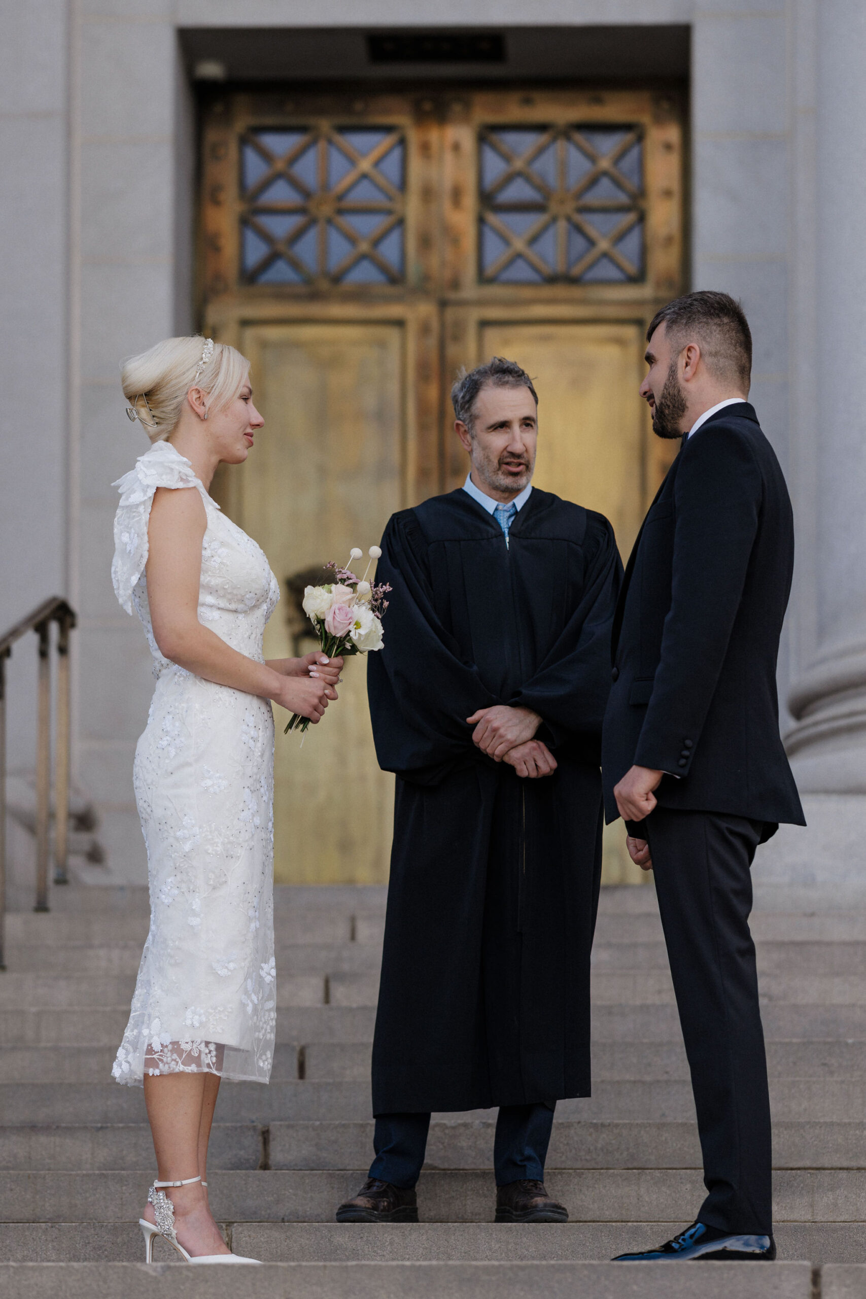 bride and groom say wedding vows during denver elopement
