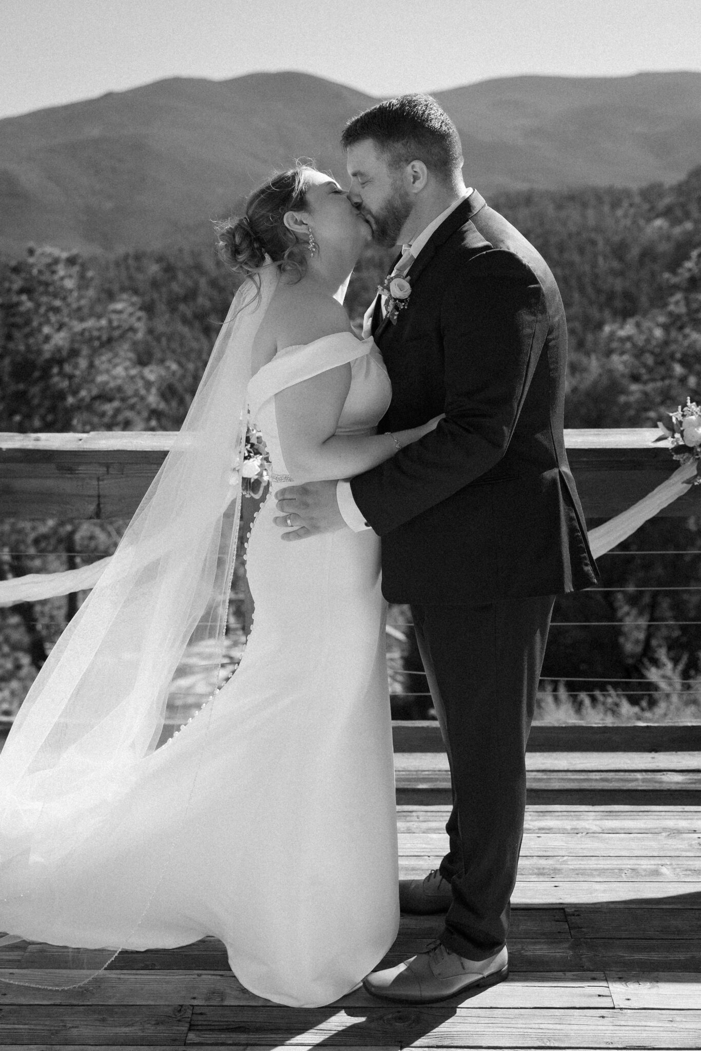 bride and groom kiss after they celebrate a vow renewal in colorado at an airbnb