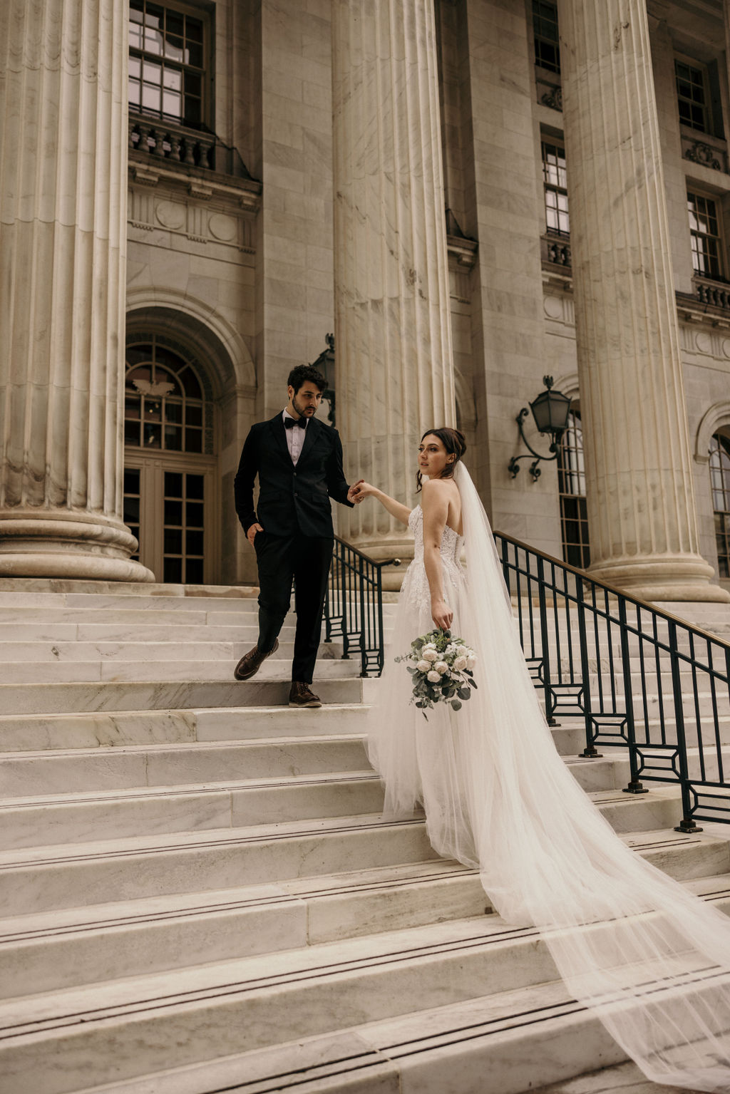 Why Renew Your Wedding Vows? Ideas, Reasons, + How-To: bride and groom walk up steps at byron white courthouse in denver