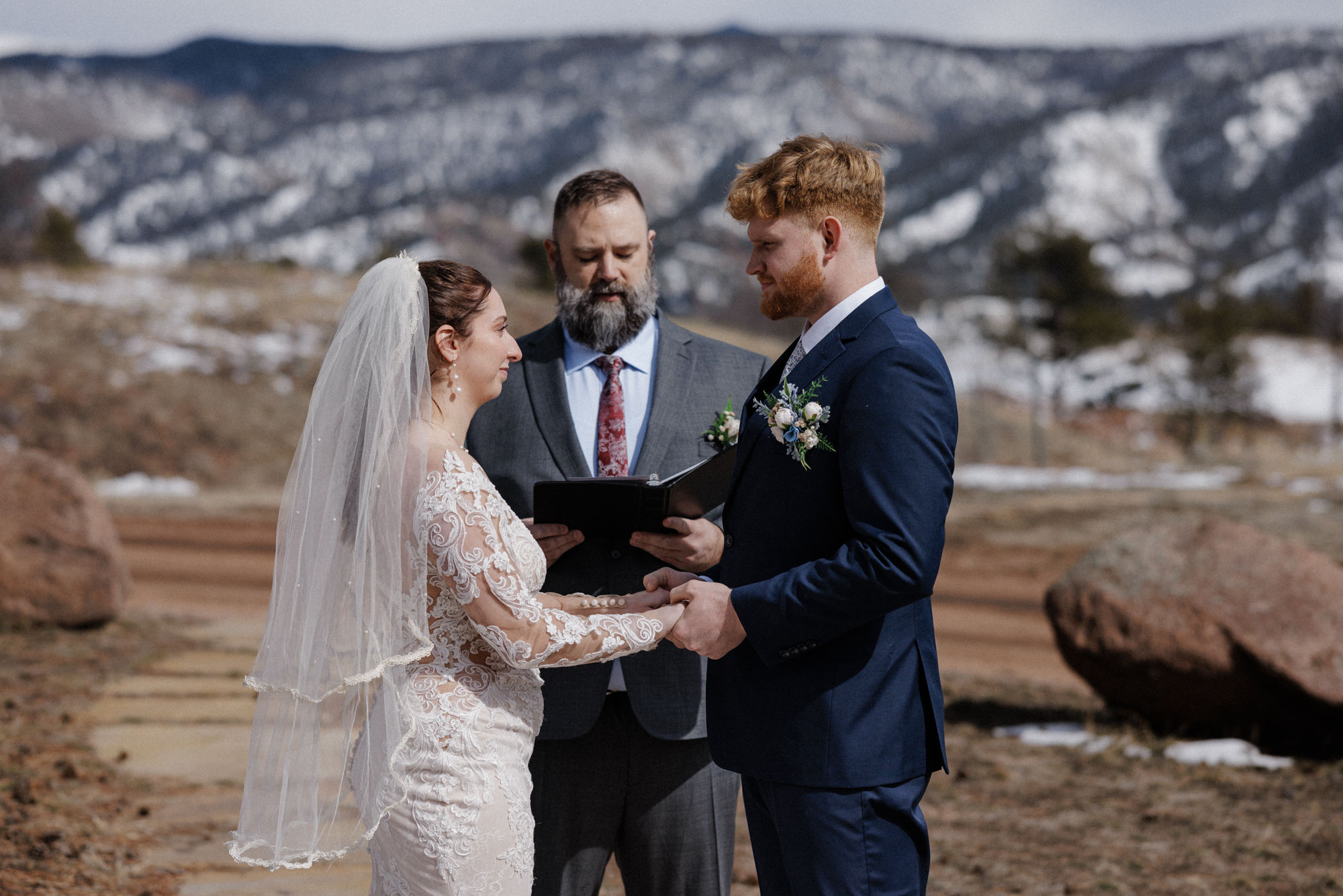 bride and groom say wedding vows at colorado micro wedding venue - airbnb.