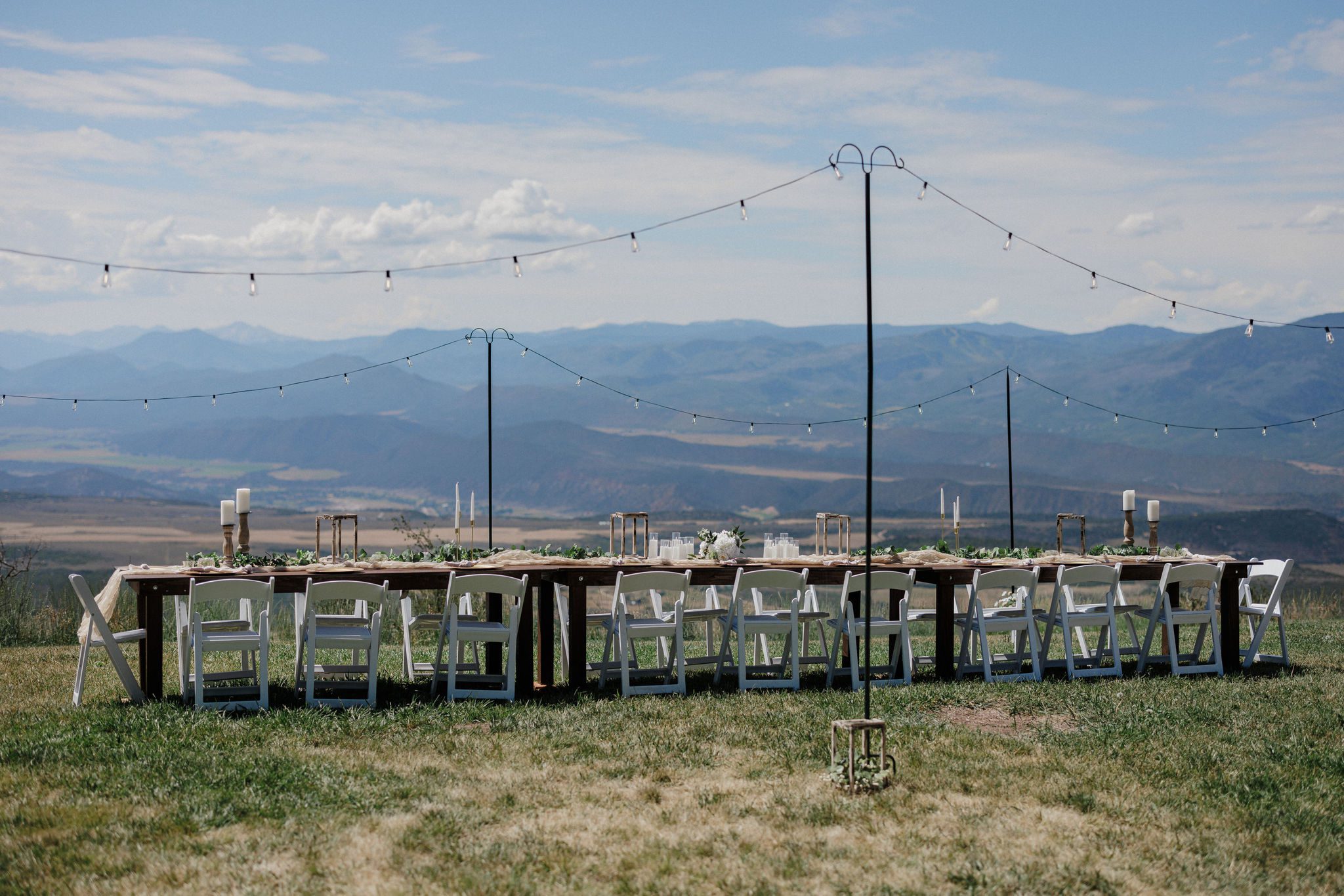 long family style table set up at lodging for a micro wedding reception in glenwood springs, CO