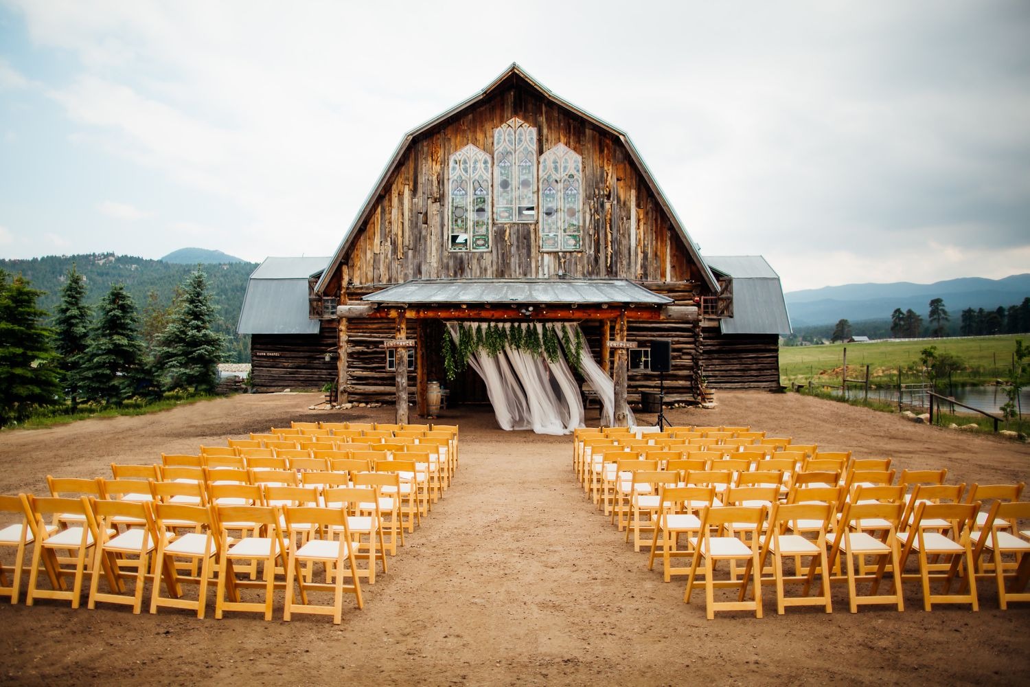 outdoor micro wedding ceremony at the barn at evergreen wedding venue