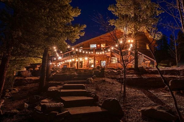 nighttime view of mountain cabin used for micro wedding venue in colorado