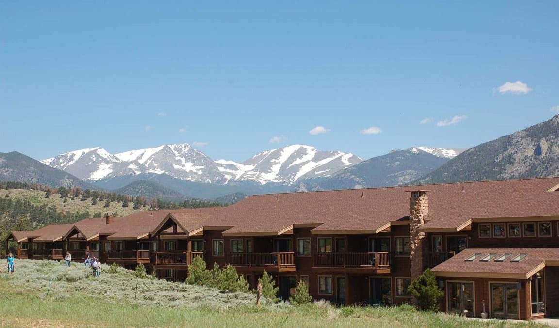 micro wedding accommodations sit in front of the snowy colorado mountains