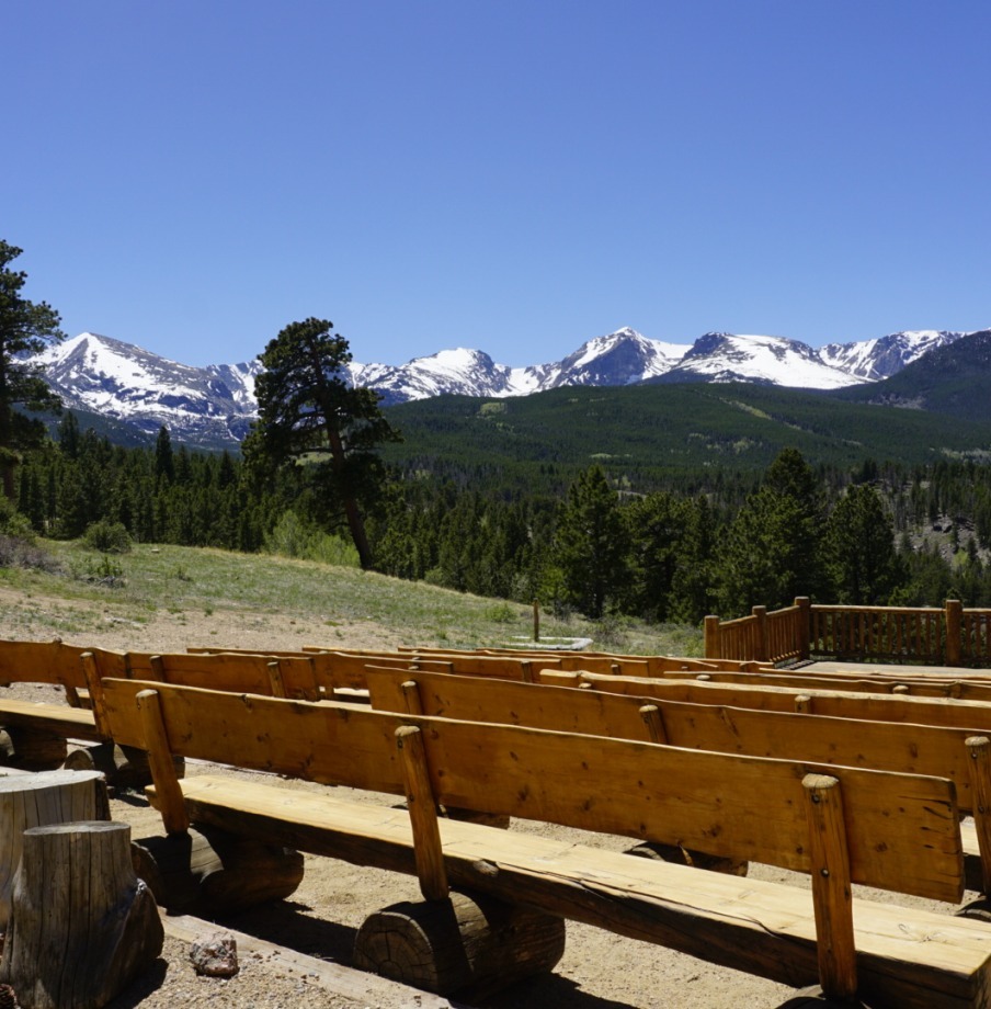 benches set up for a micro wedding or elopement ceremony overlooking the colorado mountains