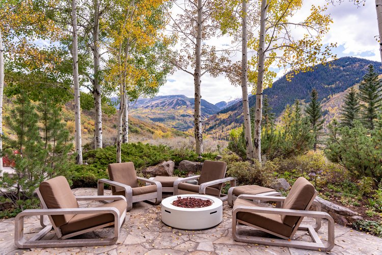 chairs and firepit set up at colorado micro wedding venue in the mountains