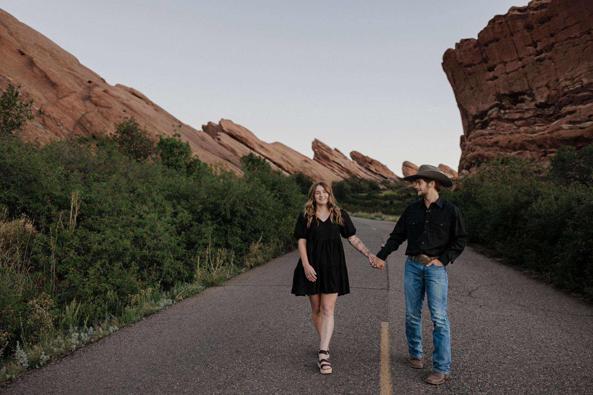 engaged couple takes engagement photos at red rocks park