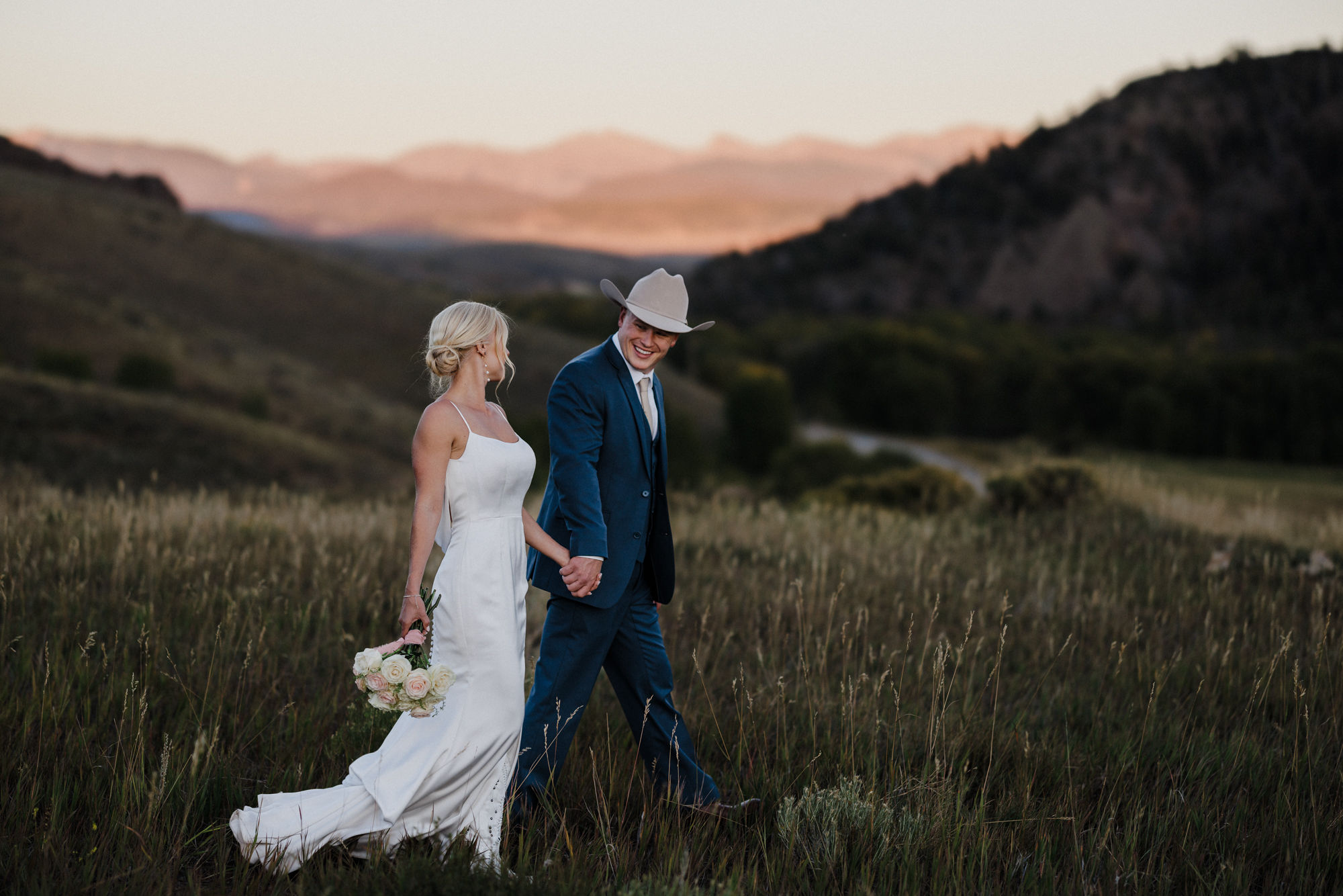 after narrowing wedding guest list, bride and groom take photos during micro wedding in colorado