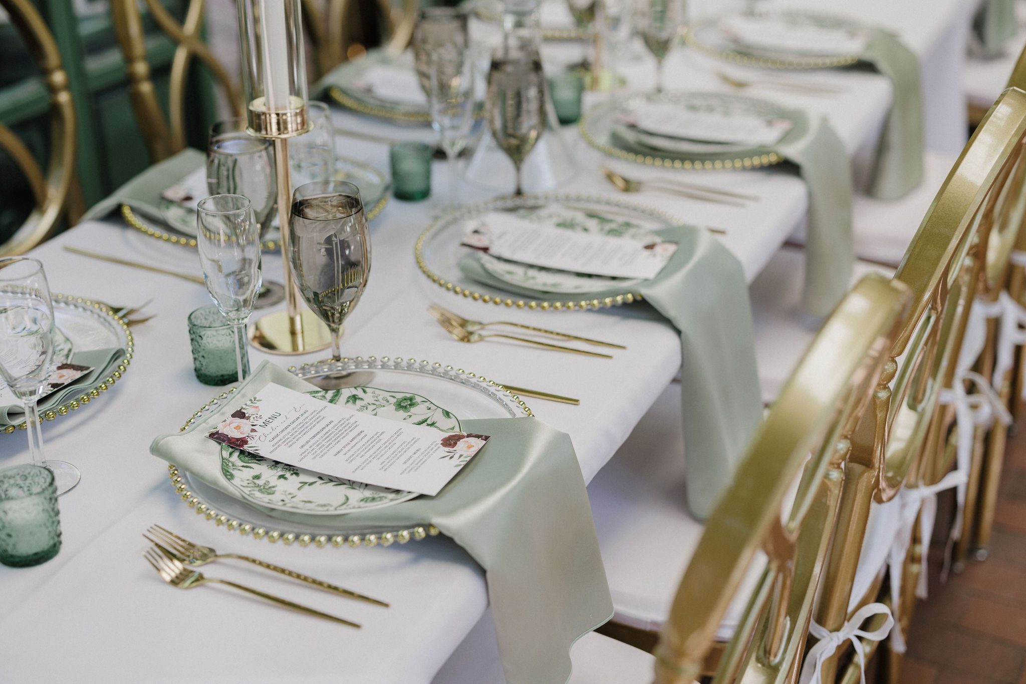 questions to ask wedding vendors: table set up with caterers' menus and plates