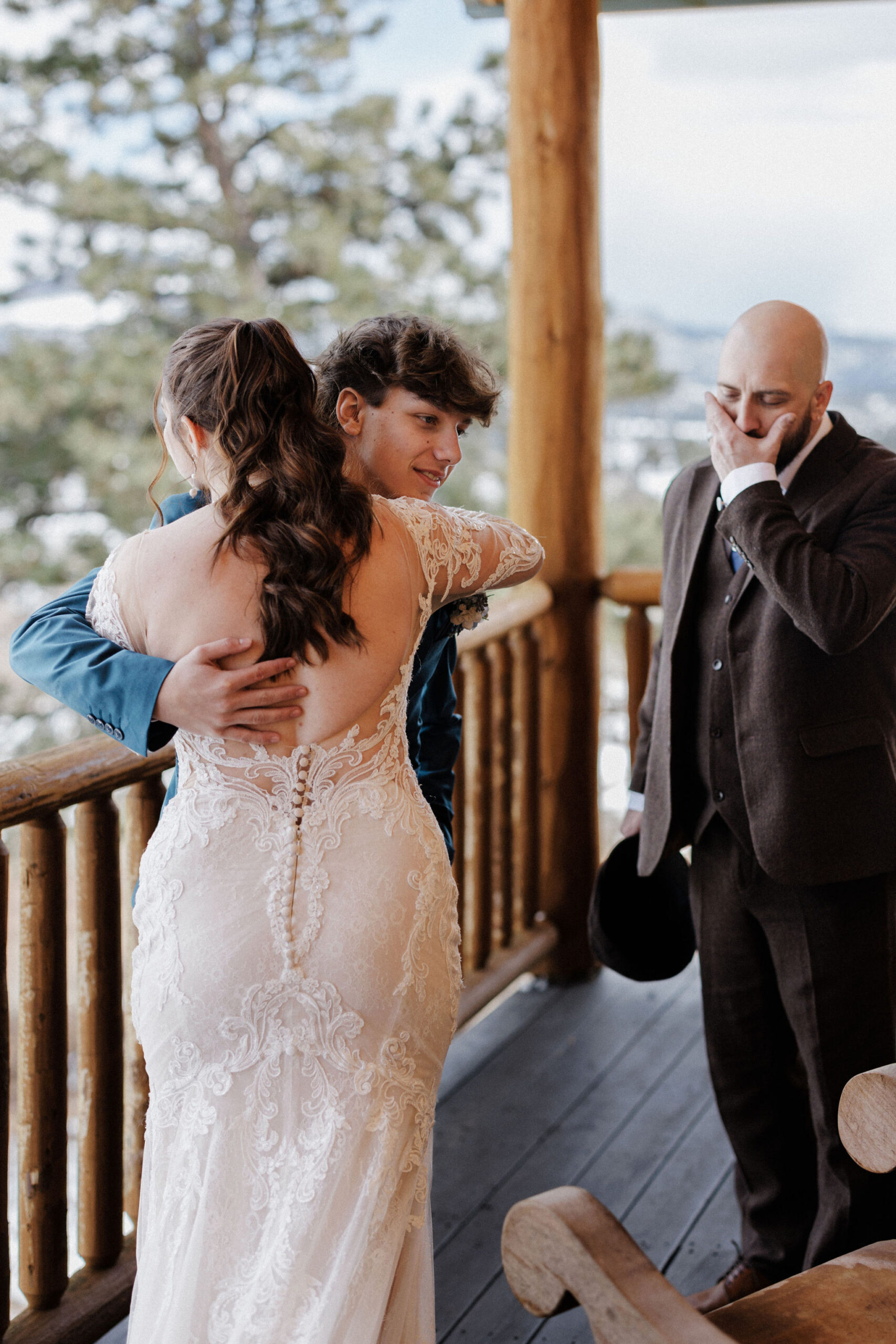 bride hugs brother during family first look at micro wedding