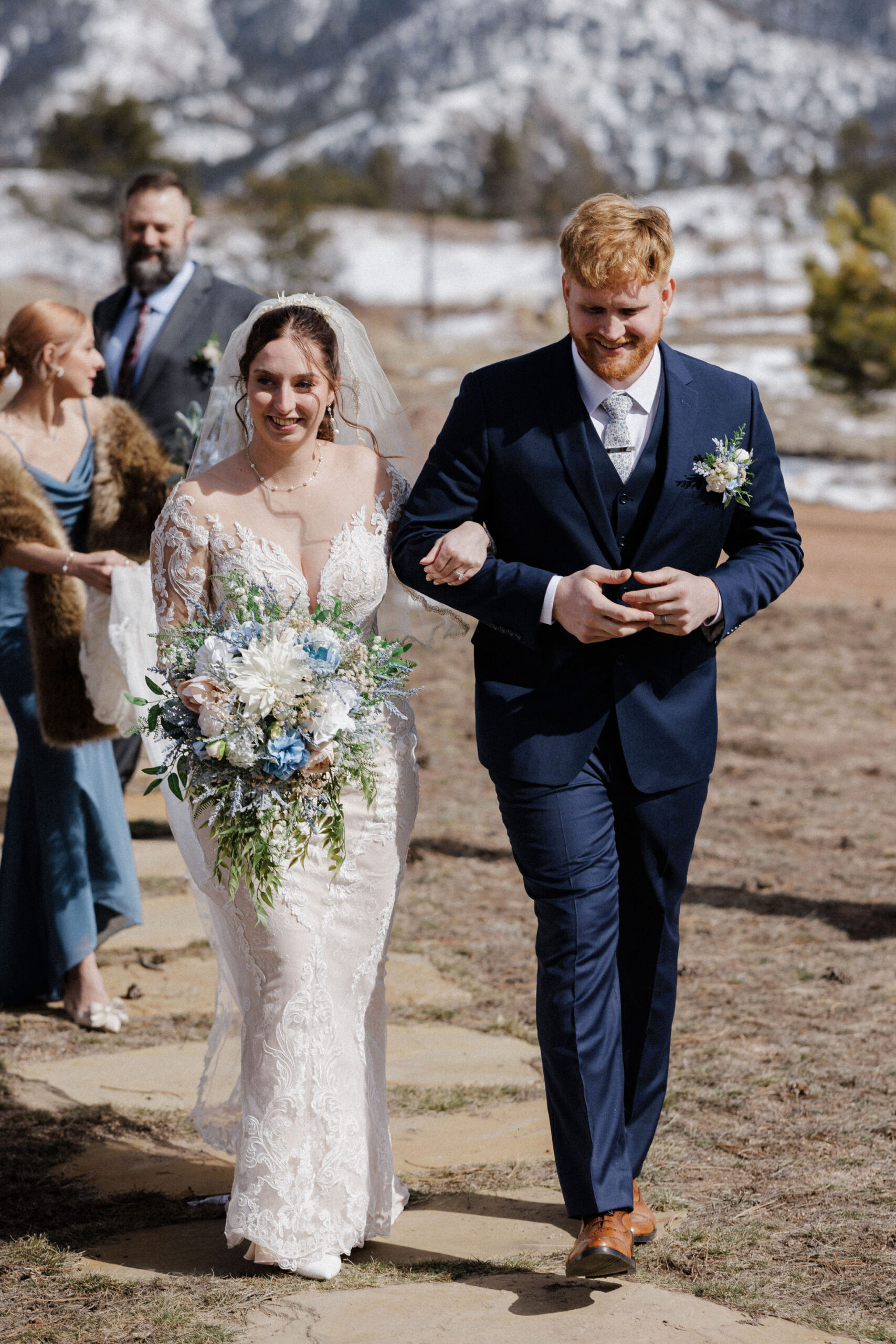 bride and groom walk down aisle during colorado micro wedding photographer