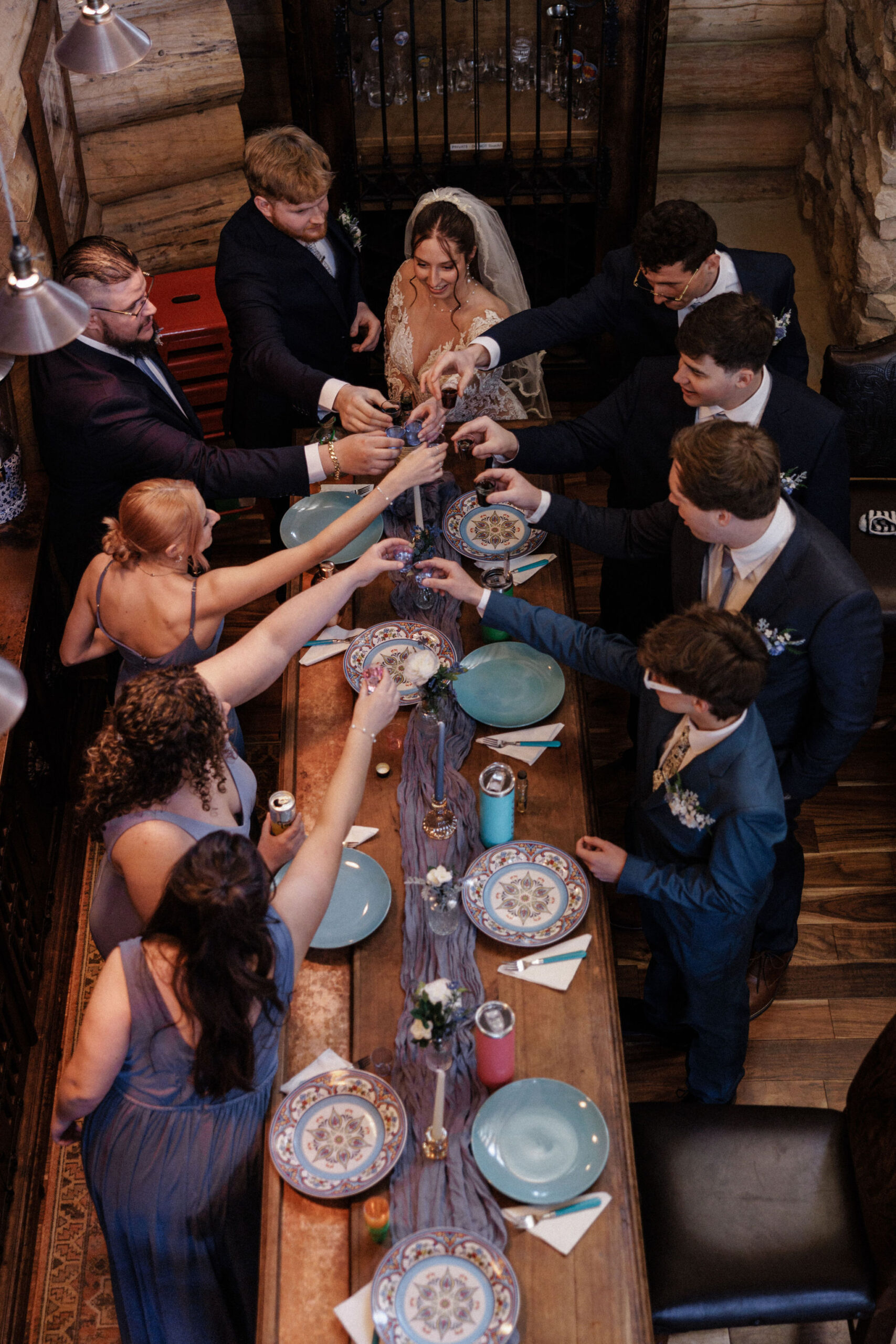 after asking questions to wedding vendors, bride, groom, and family make a toast