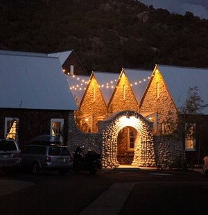 french-style guest lodging lit up at colorado micro wedding venue