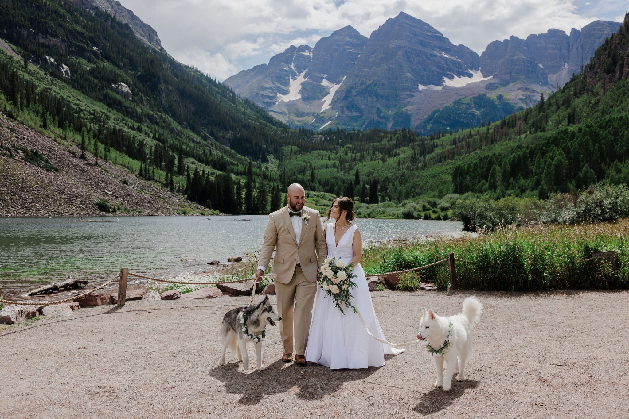 during their colorado elopement with dogs, bride and groom pose for photos