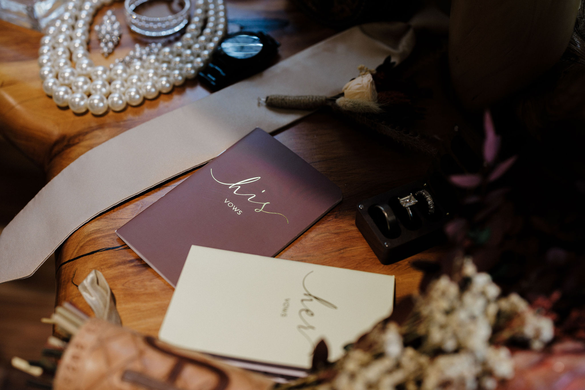 vow books sit beside wedding day details