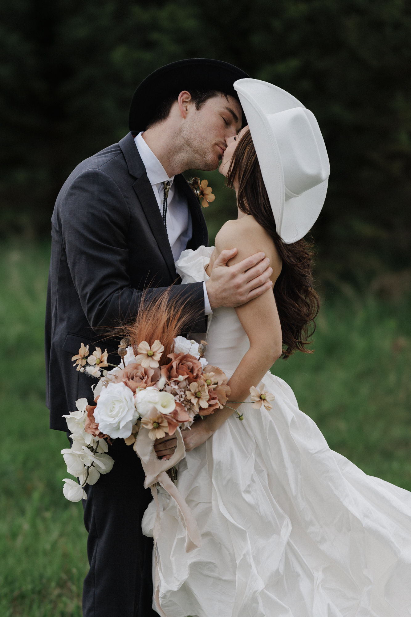 bride and groom pose for wedding photos