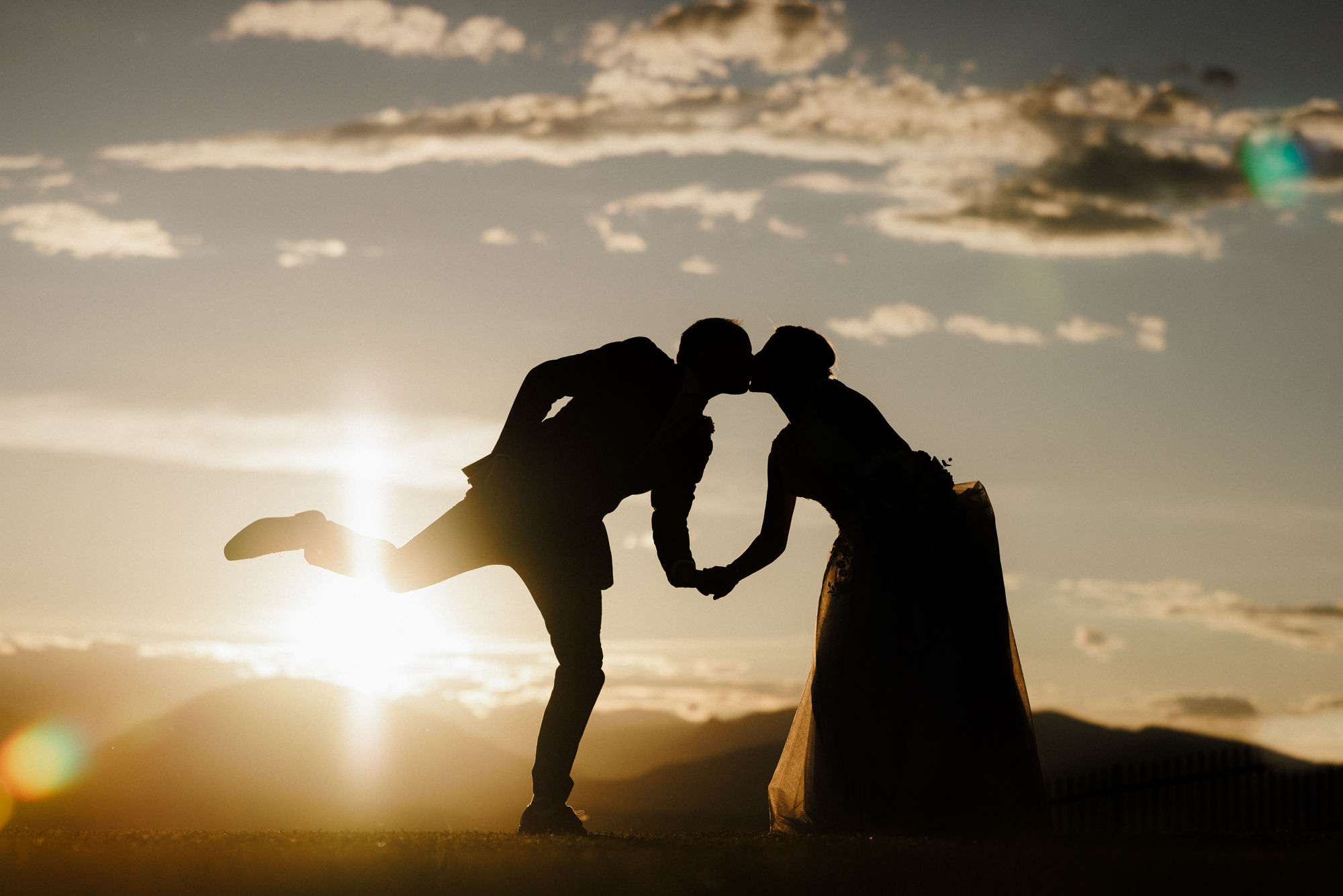 after finsihing elopement planning and checklist, bride and groom pose for wedding photos during sunset