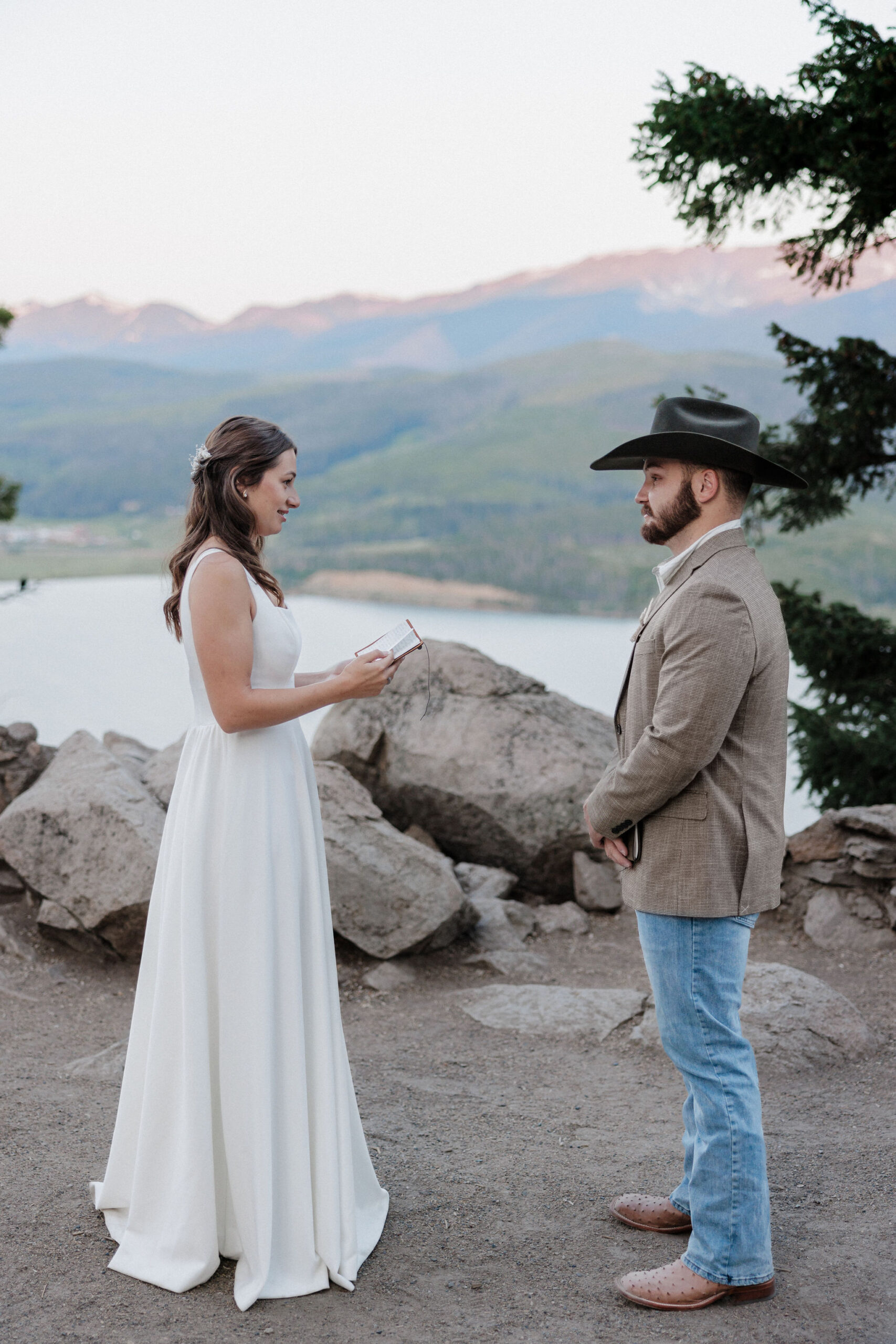 bride reads wedding vows to groom during colorado elopement