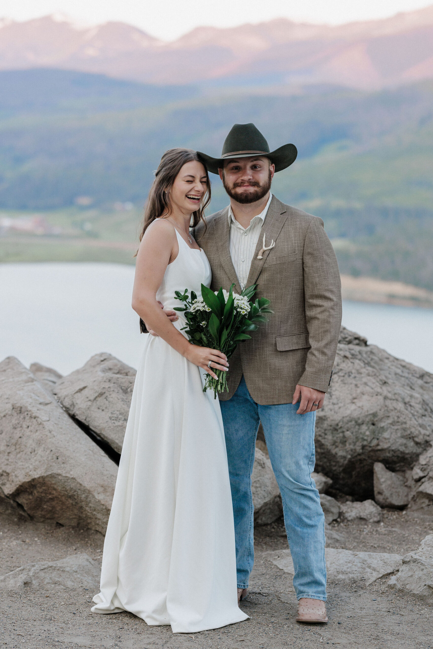 bride and groom laugh during wedding photos