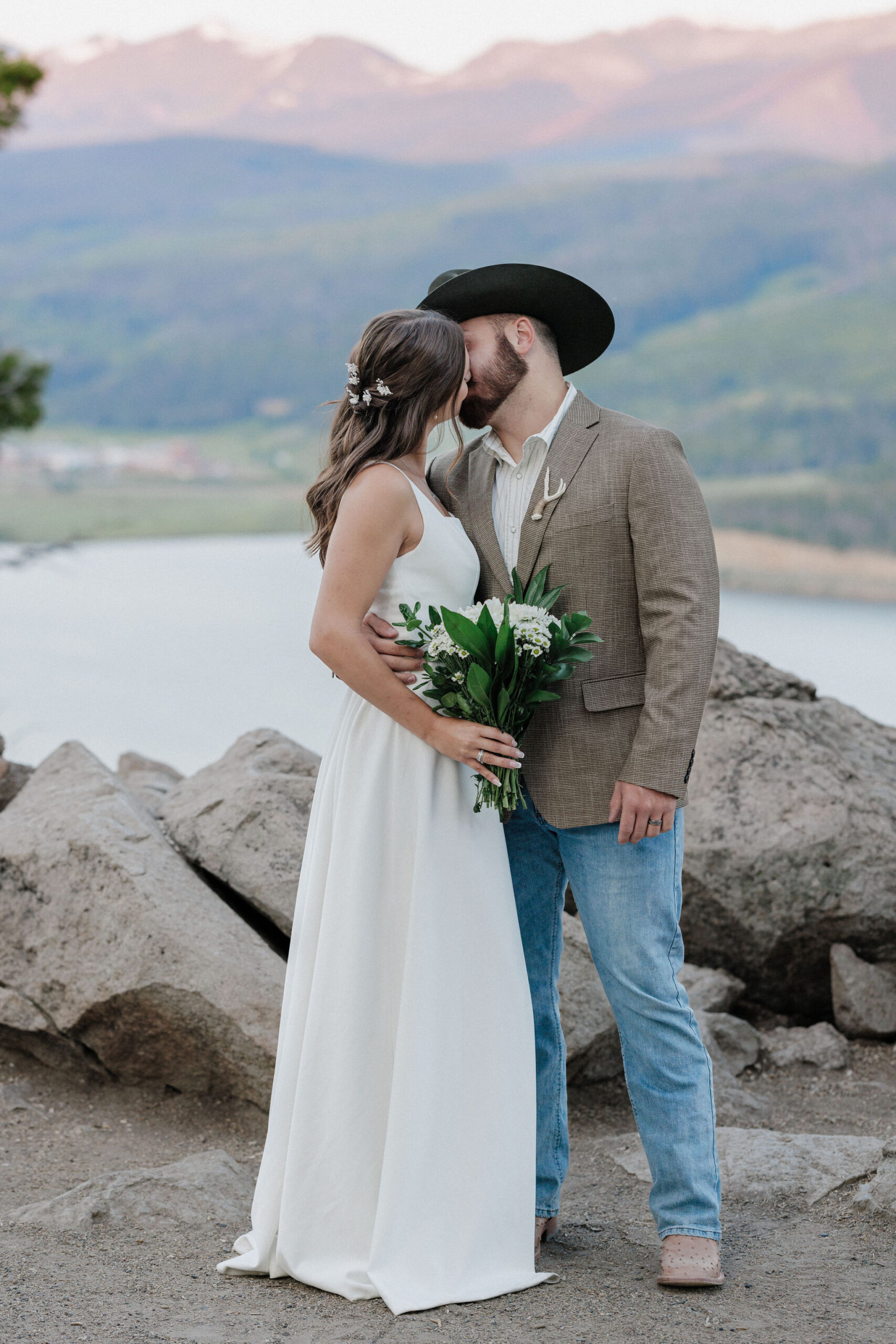 bride and groom kiss after sunrise elopement ceremony